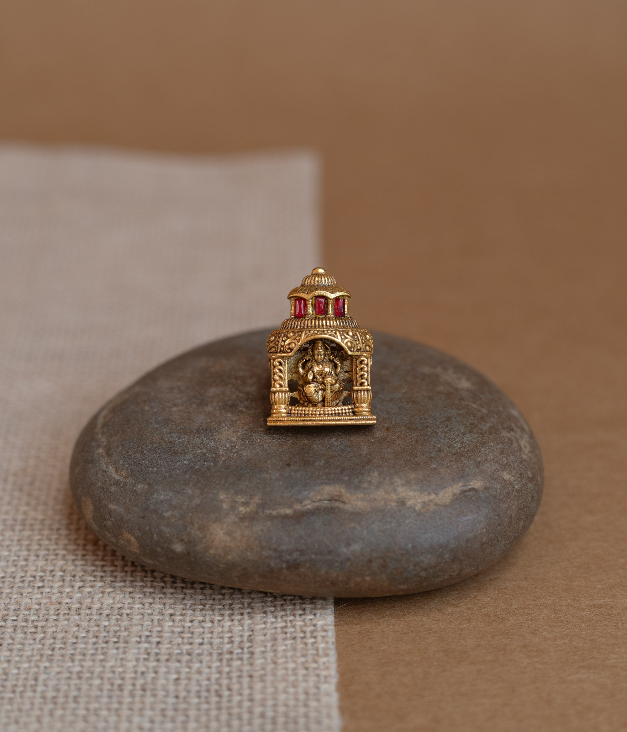 Temple ring with white Polki stone, traditional circular design, elegant for festive and cultural wear.