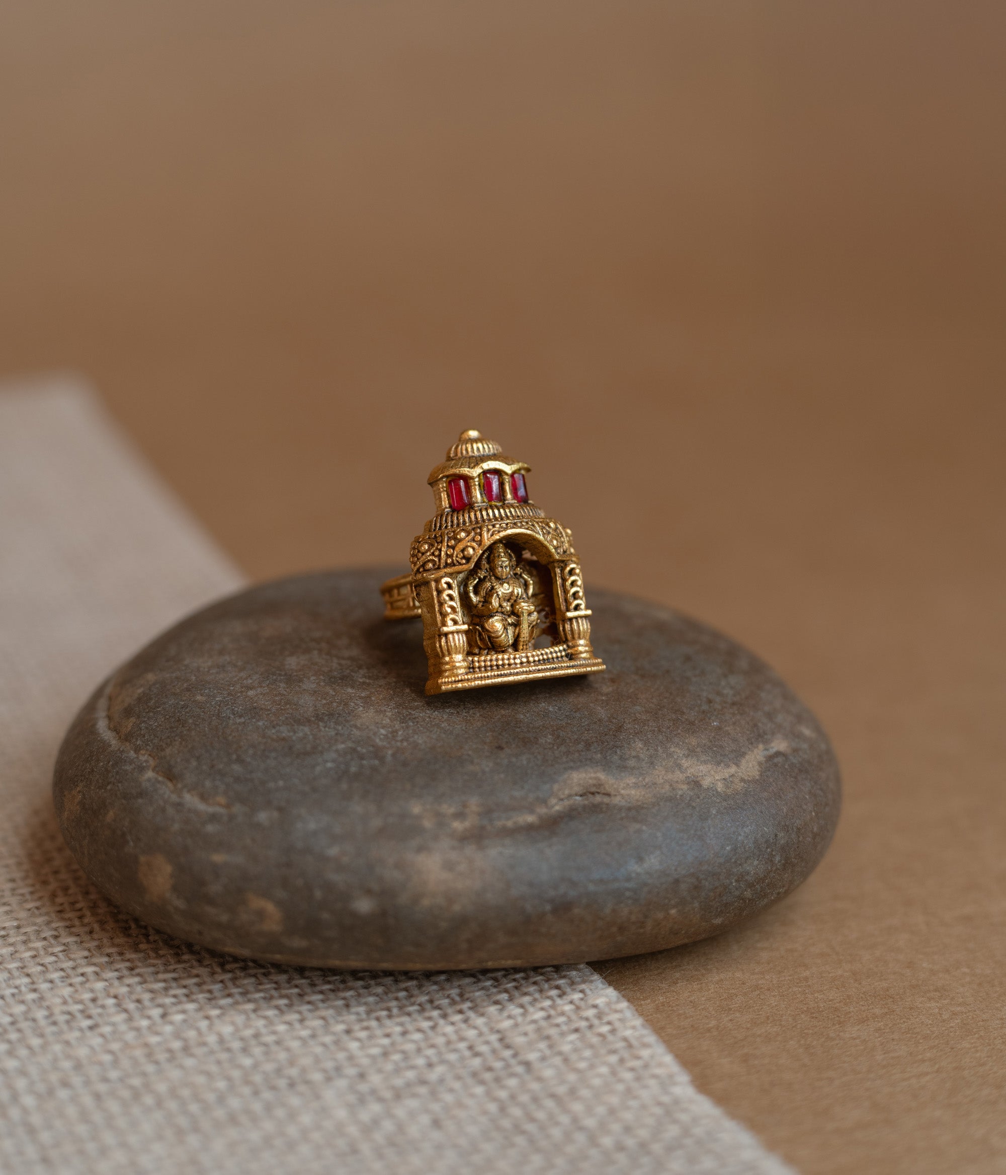 Temple ring with white Polki stone, traditional circular design, elegant for festive and cultural wear.