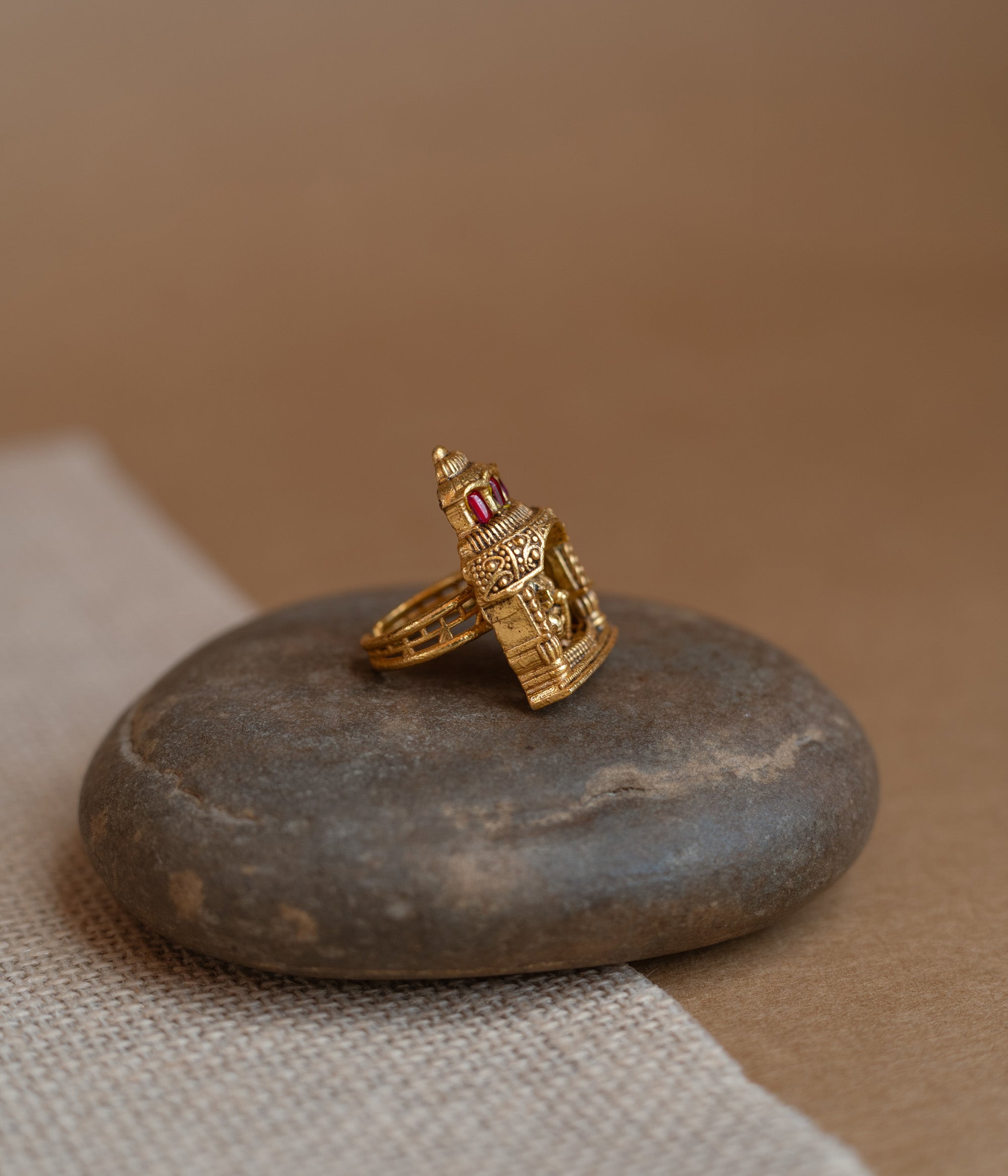 Temple ring with white Polki stone, traditional circular design, elegant for festive and cultural wear.