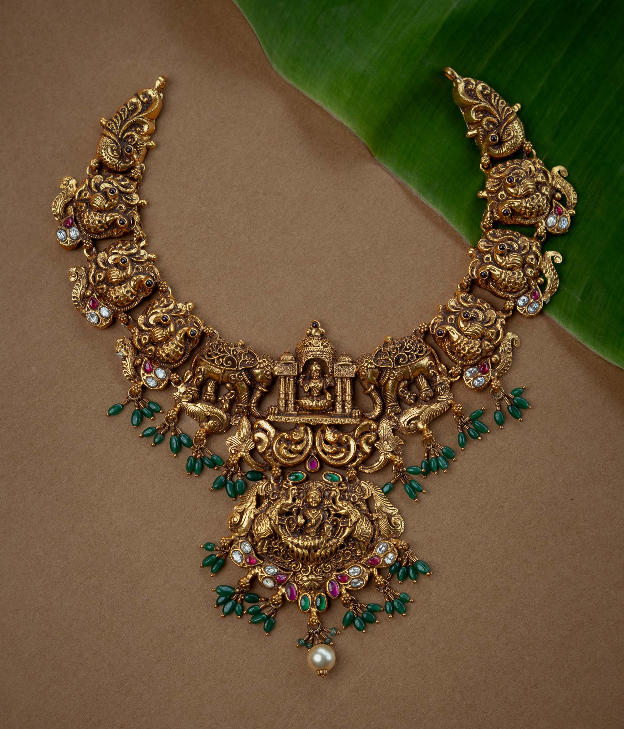 Ornate temple kundan and pearl necklace