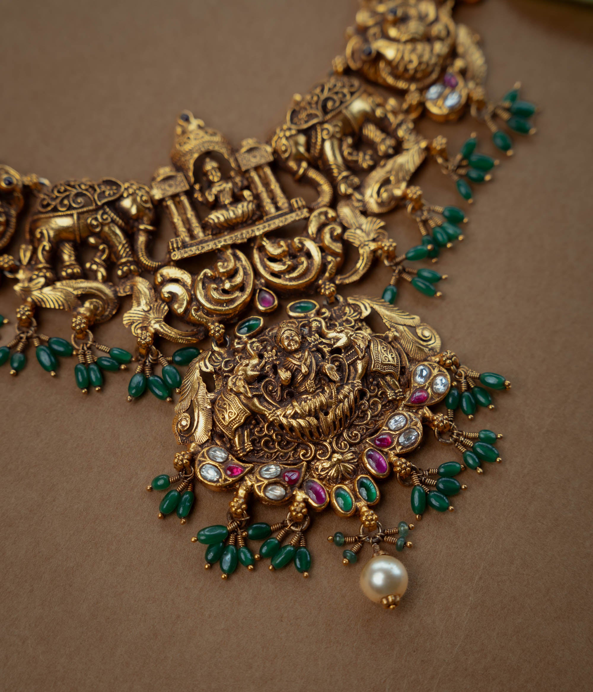 Ornate temple kundan and pearl necklace