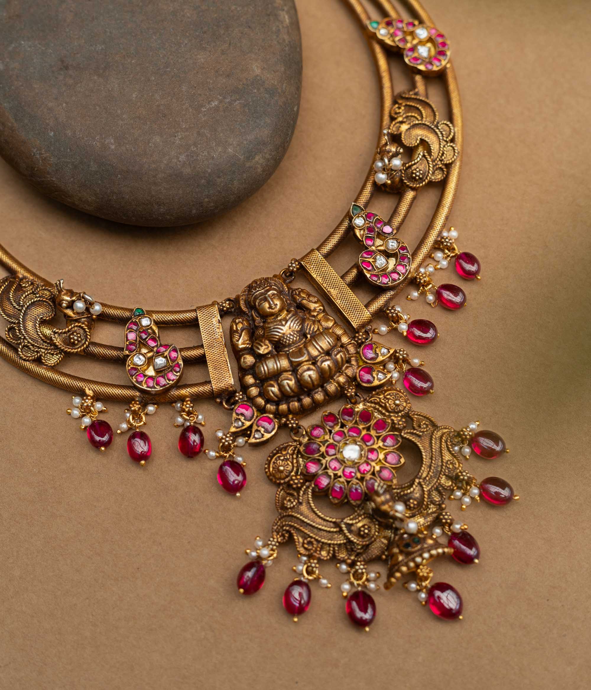 A majestic 92.5 sterling silver Meenakshi Temple Heritage Necklace, featuring a grand Lakshmi pendant, ruby red drops, and intricate meenakari paisley motifs, radiating divine elegance and royal charm for bridal and festive wear.
