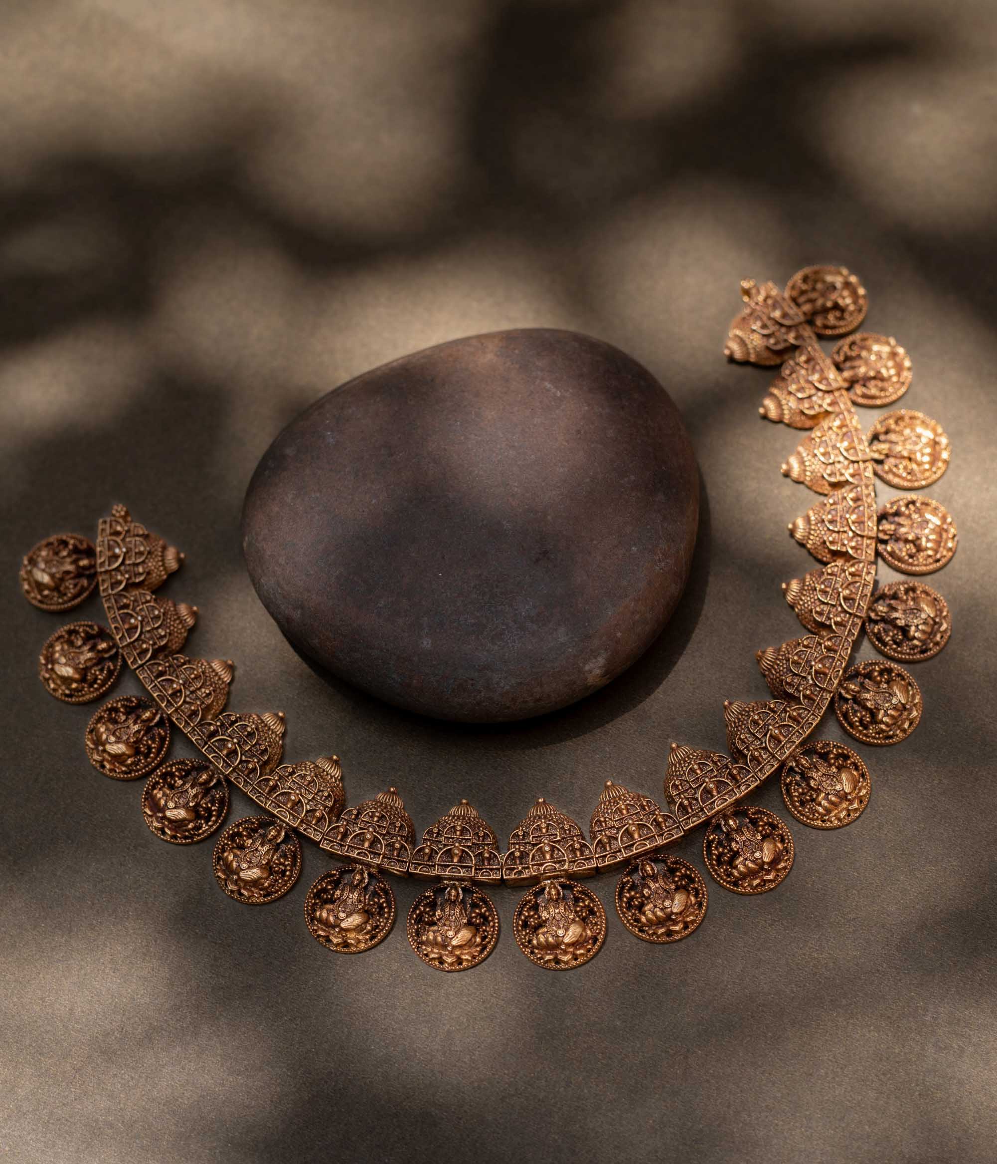 A striking 92.5 sterling silver necklace featuring intricately crafted coins depicting the Goddess (Devi) with an antique gold plating, blending traditional Indian artistry with spiritual significance, perfect for festive and cultural celebrations