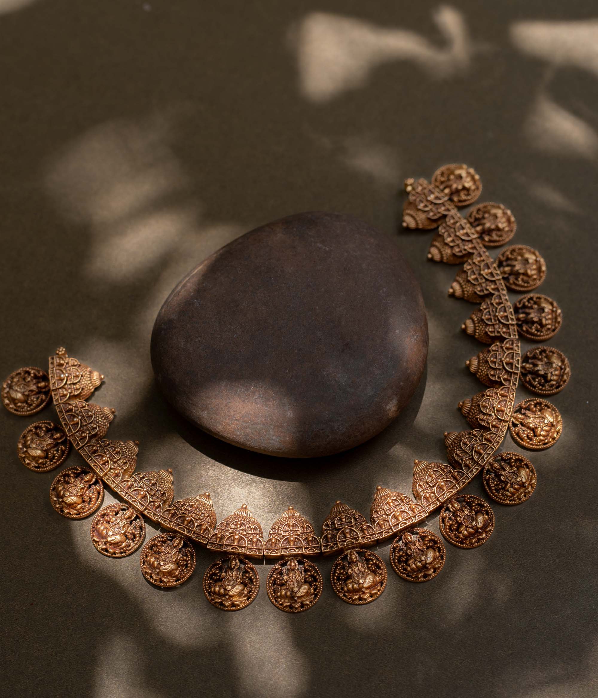 A striking 92.5 sterling silver necklace featuring intricately crafted coins depicting the Goddess (Devi) with an antique gold plating, blending traditional Indian artistry with spiritual significance, perfect for festive and cultural celebrations