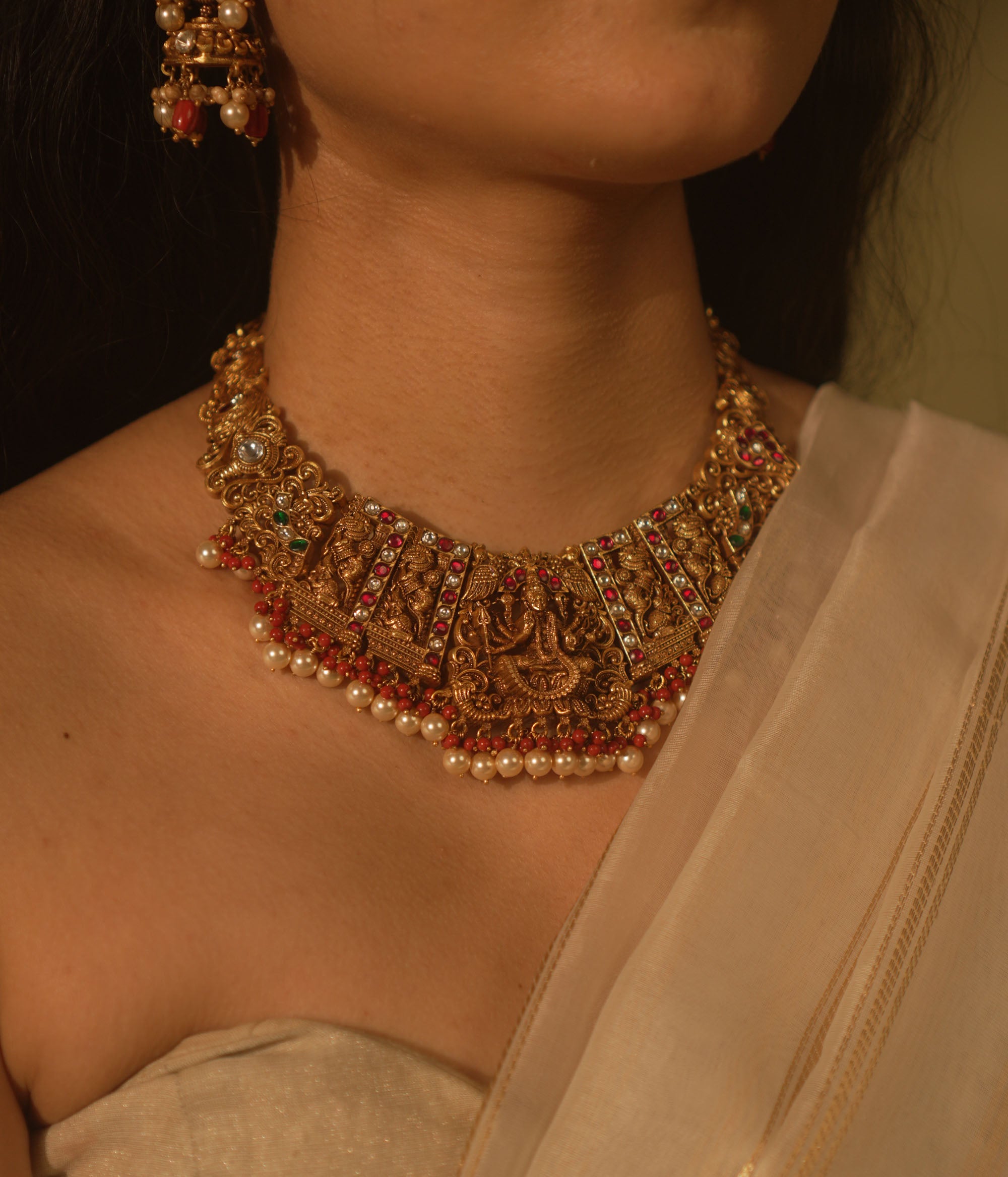 Victorious Durga necklace with pink Kundan, pearls, and coral—echoing strength and divine femininity.