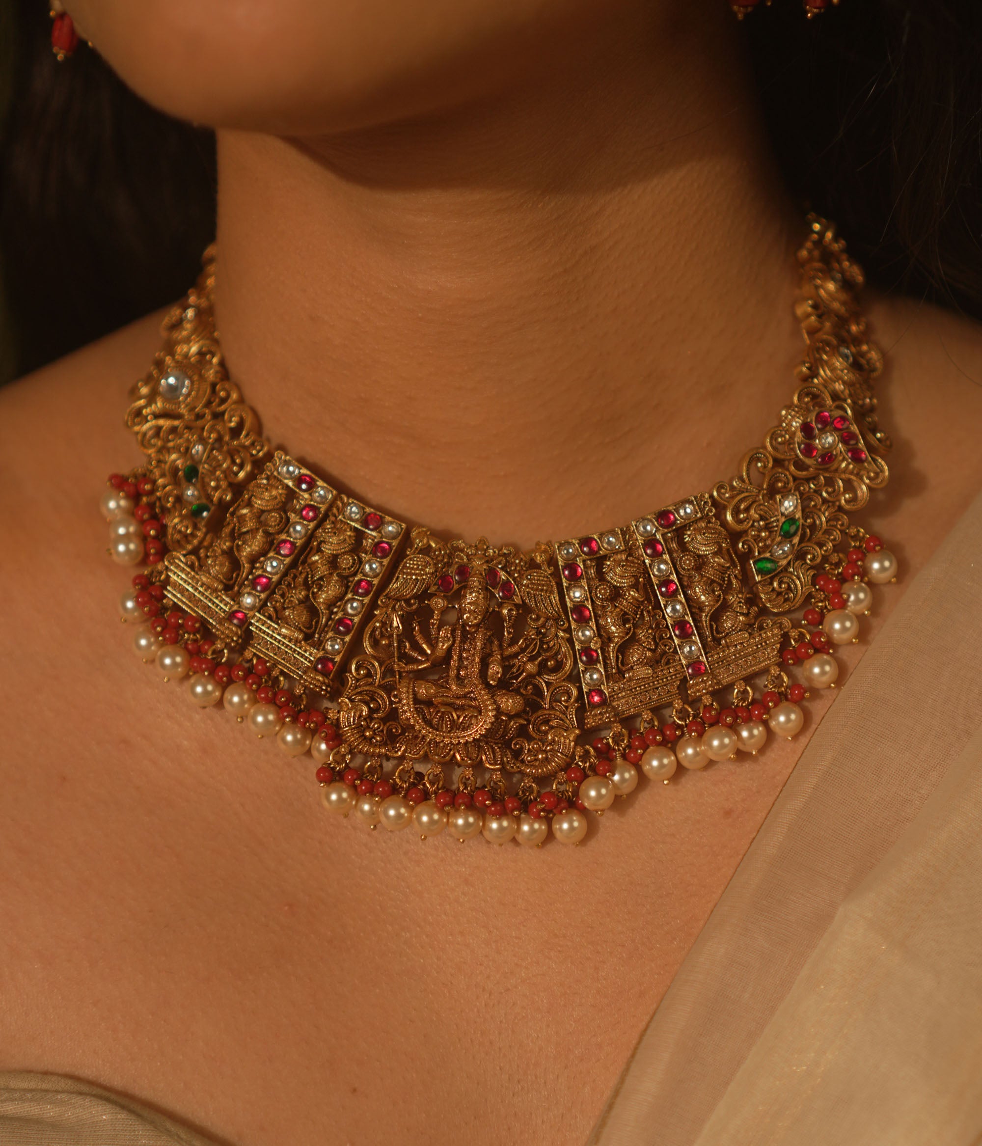 Victorious Durga necklace with pink Kundan, pearls, and coral—echoing strength and divine femininity.