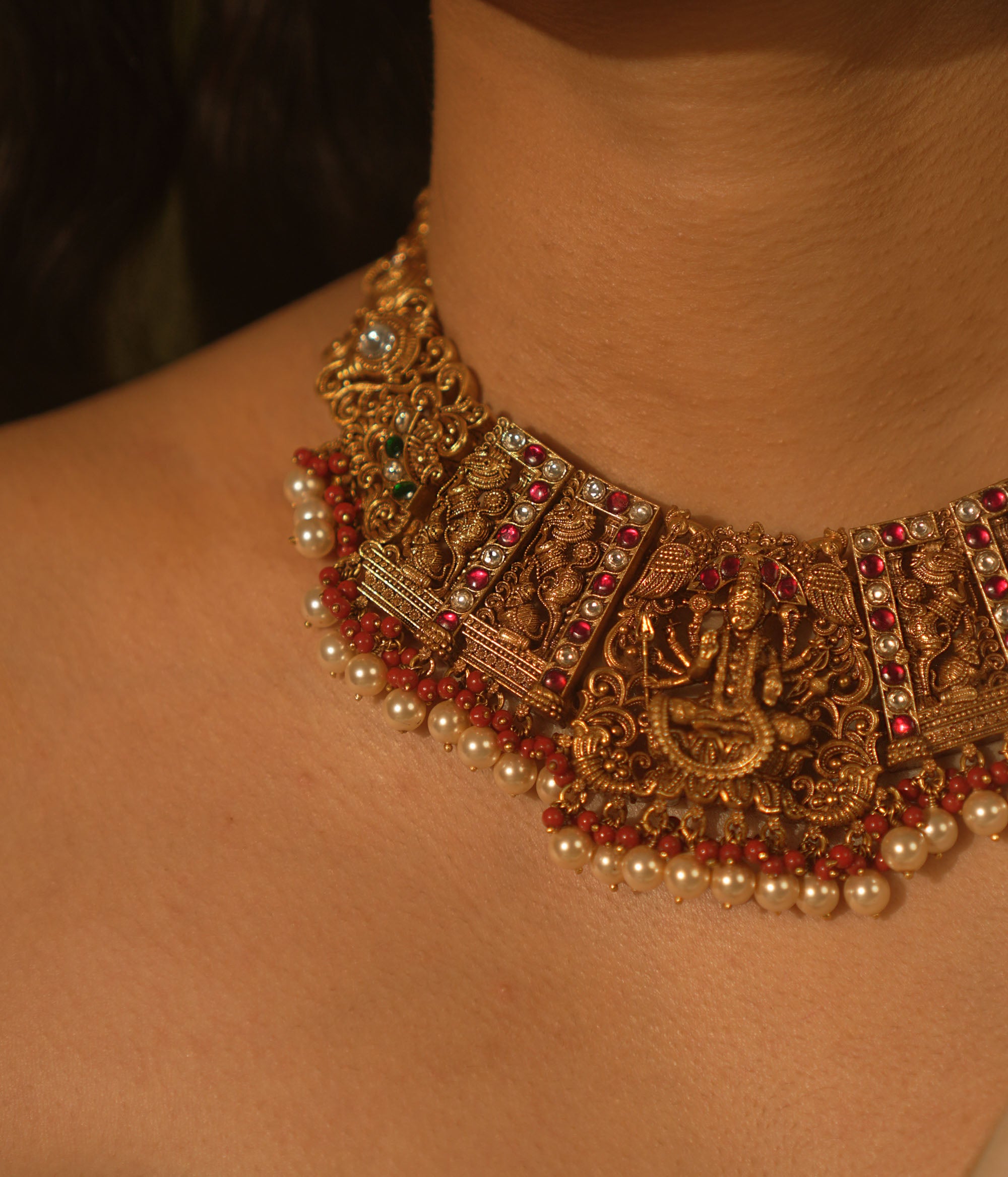 Victorious Durga necklace with pink Kundan, pearls, and coral—echoing strength and divine femininity.