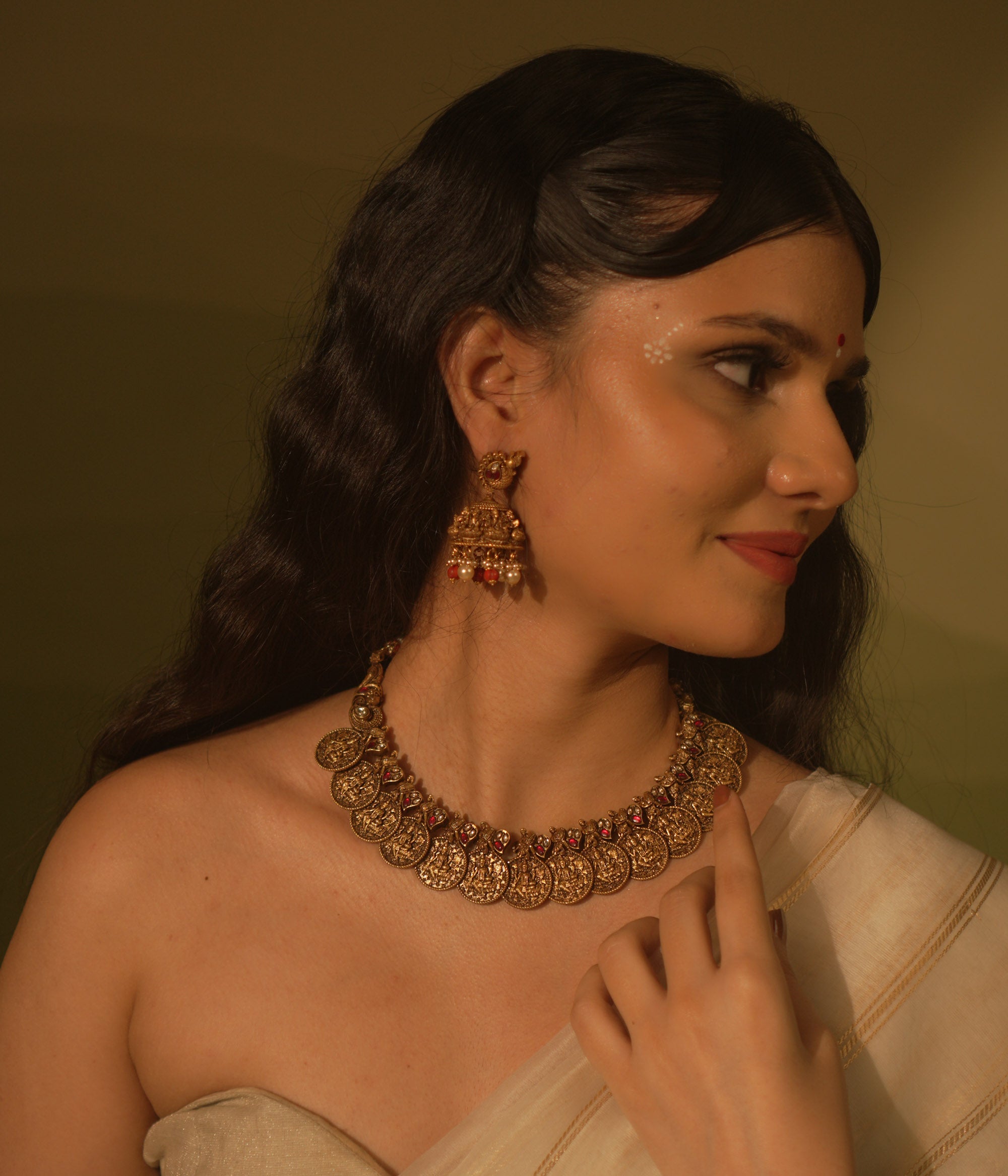 Temple collection Shyla Necklace featuring kasu coin motifs, pink Kundan stones, and divine Goddess Lakshmi-inspired design.