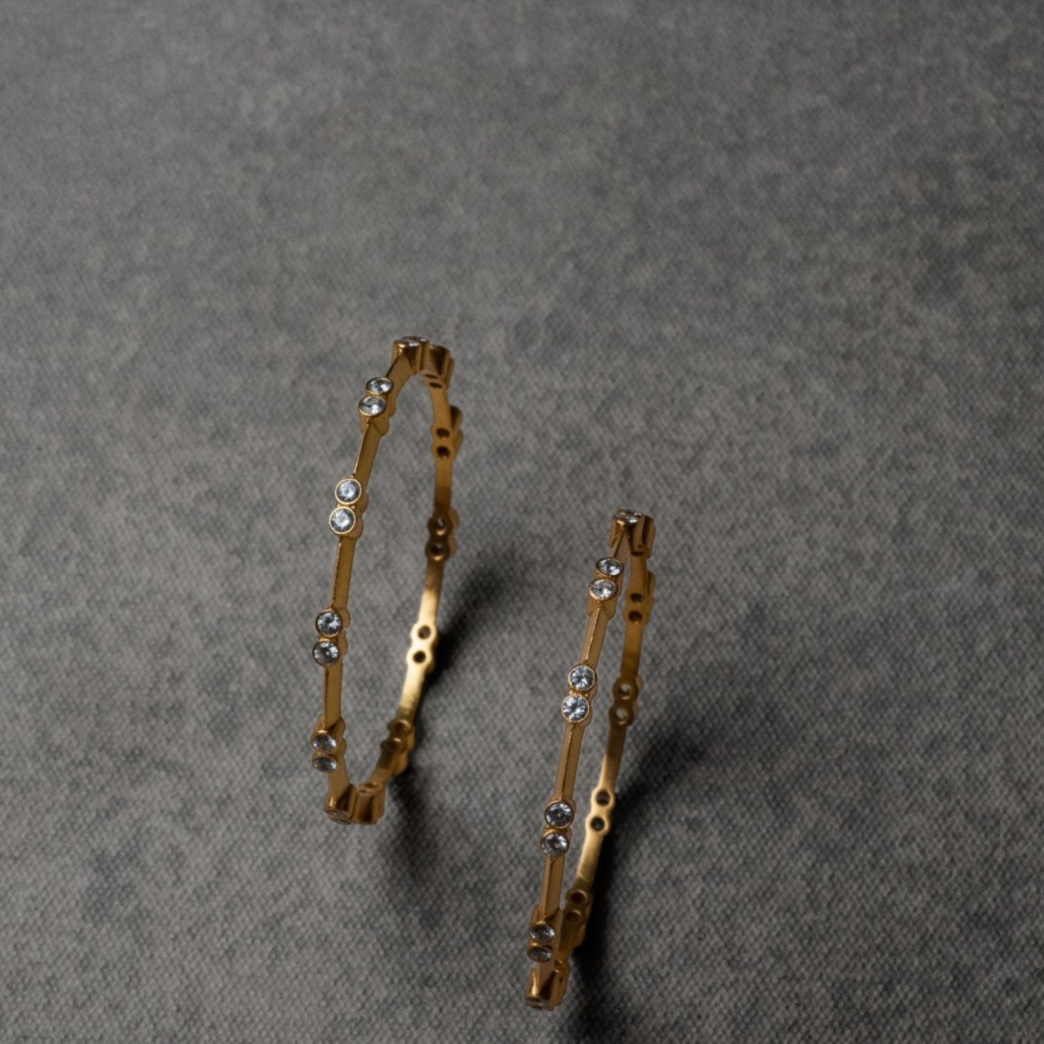 A sleek sterling silver bangle adorned with CZ stones, exuding understated elegance and sophistication—an ideal accessory to elevate any outfit with a touch of sparkle.