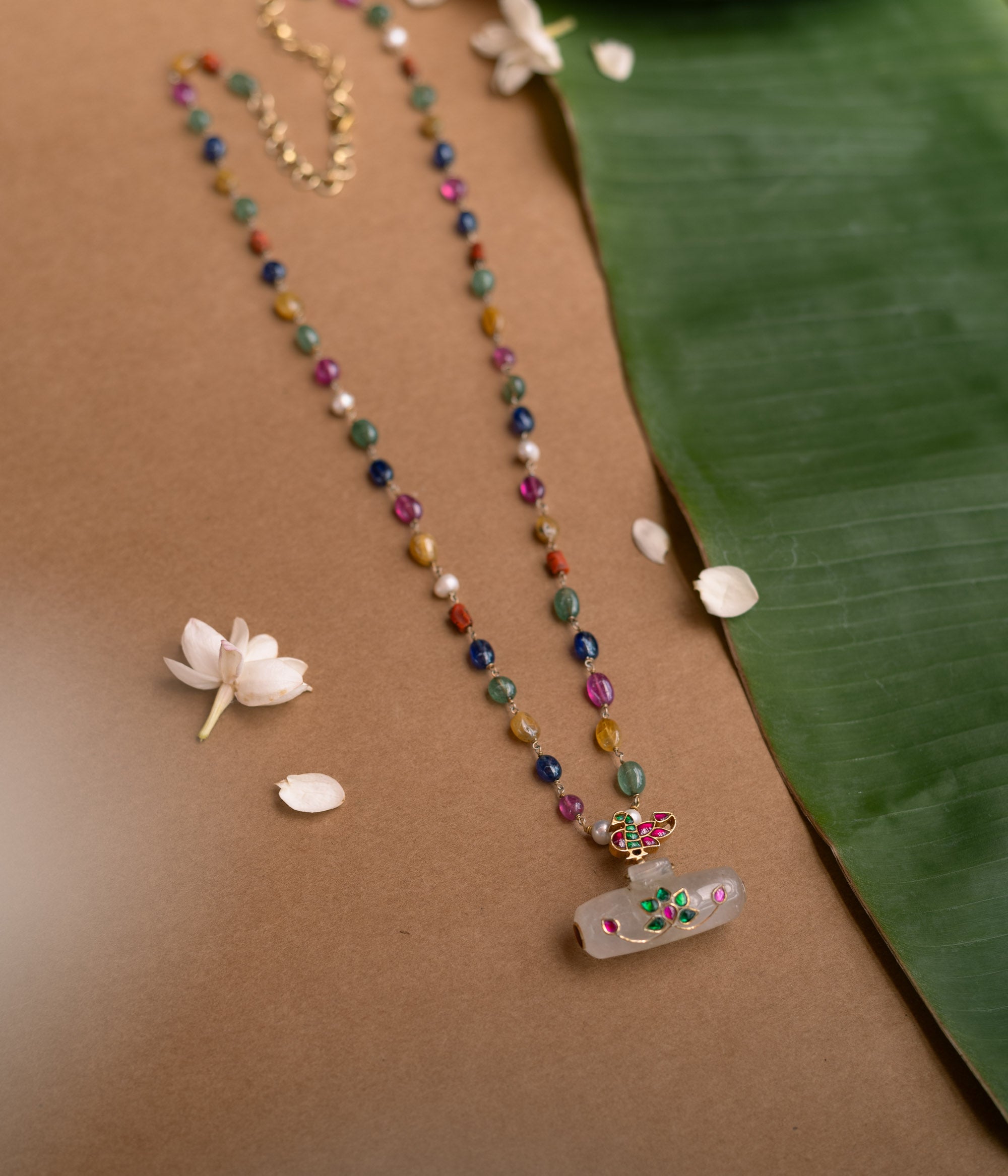 Hue Collection Celestial Harmony Necklace with multi-colored gemstone beads and floral enamel pendant.