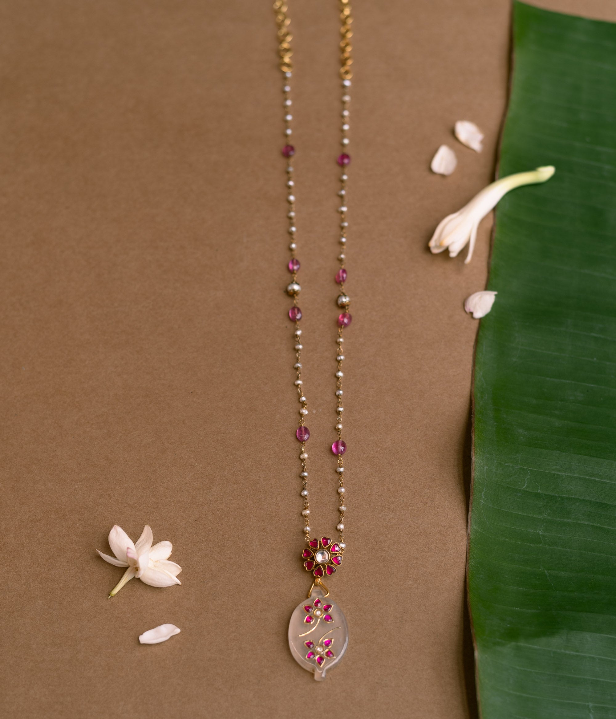 Hue Collection Blossom Whisper Necklace with pearls, pink beads, and floral pendant design.