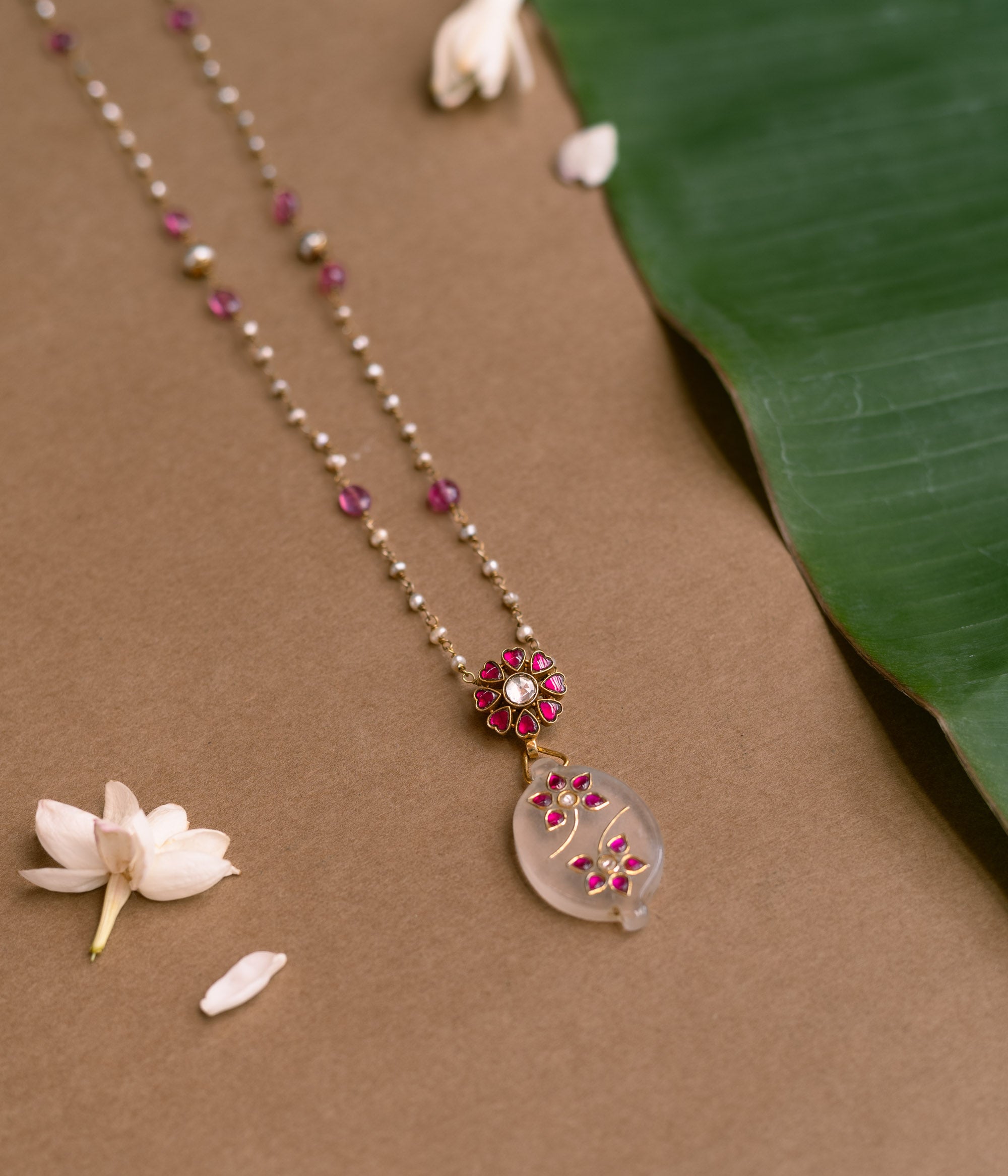 Hue Collection Blossom Whisper Necklace with pearls, pink beads, and floral pendant design.