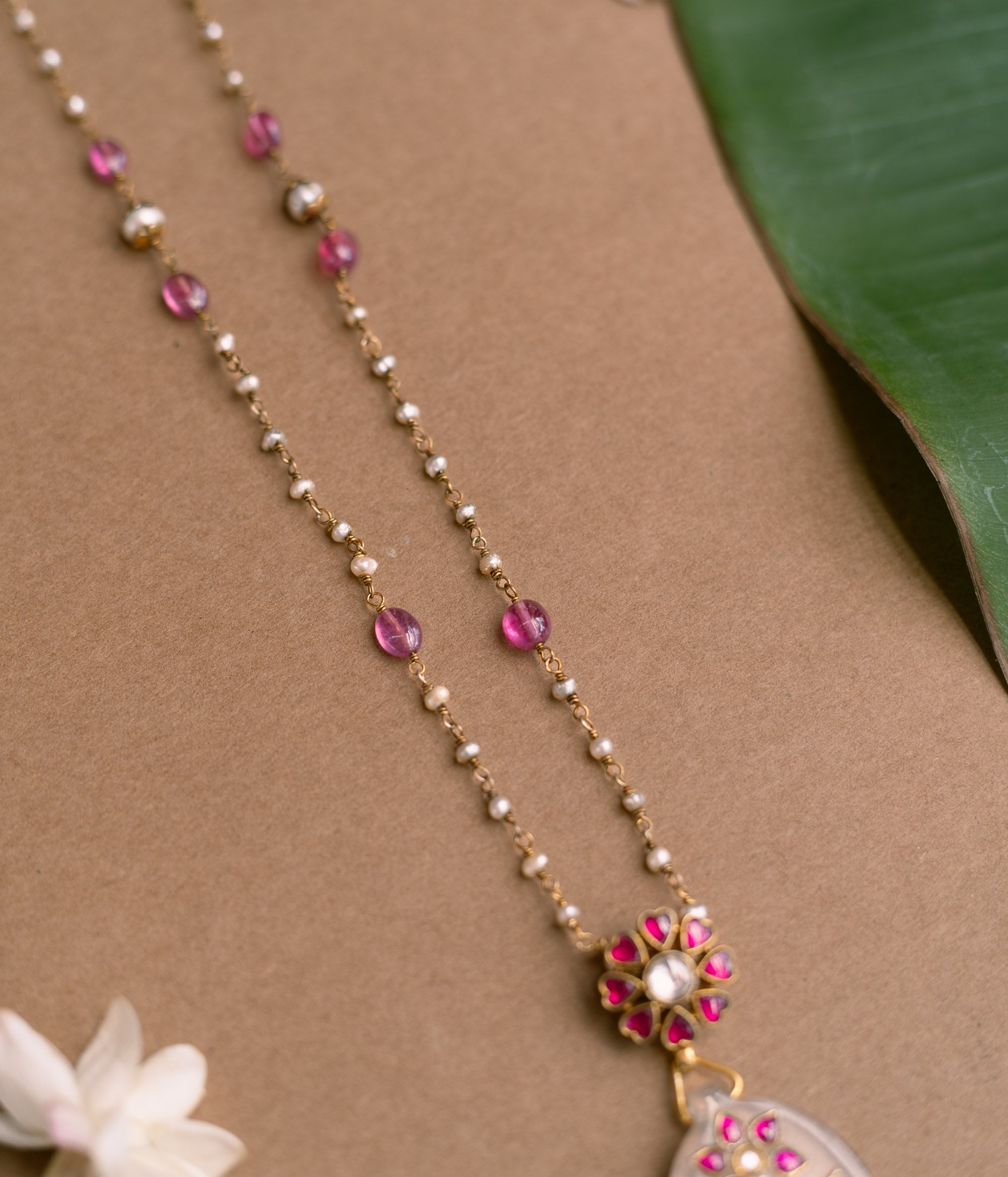 Hue Collection Blossom Whisper Necklace with pearls, pink beads, and floral pendant design.
