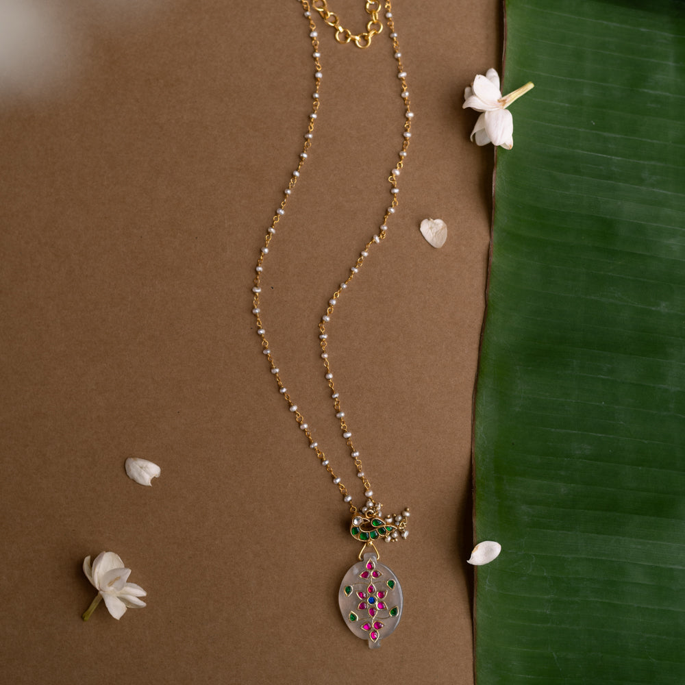Hue Collection Lotus Glow Necklace with floral enamel pendant and delicate beaded chain.