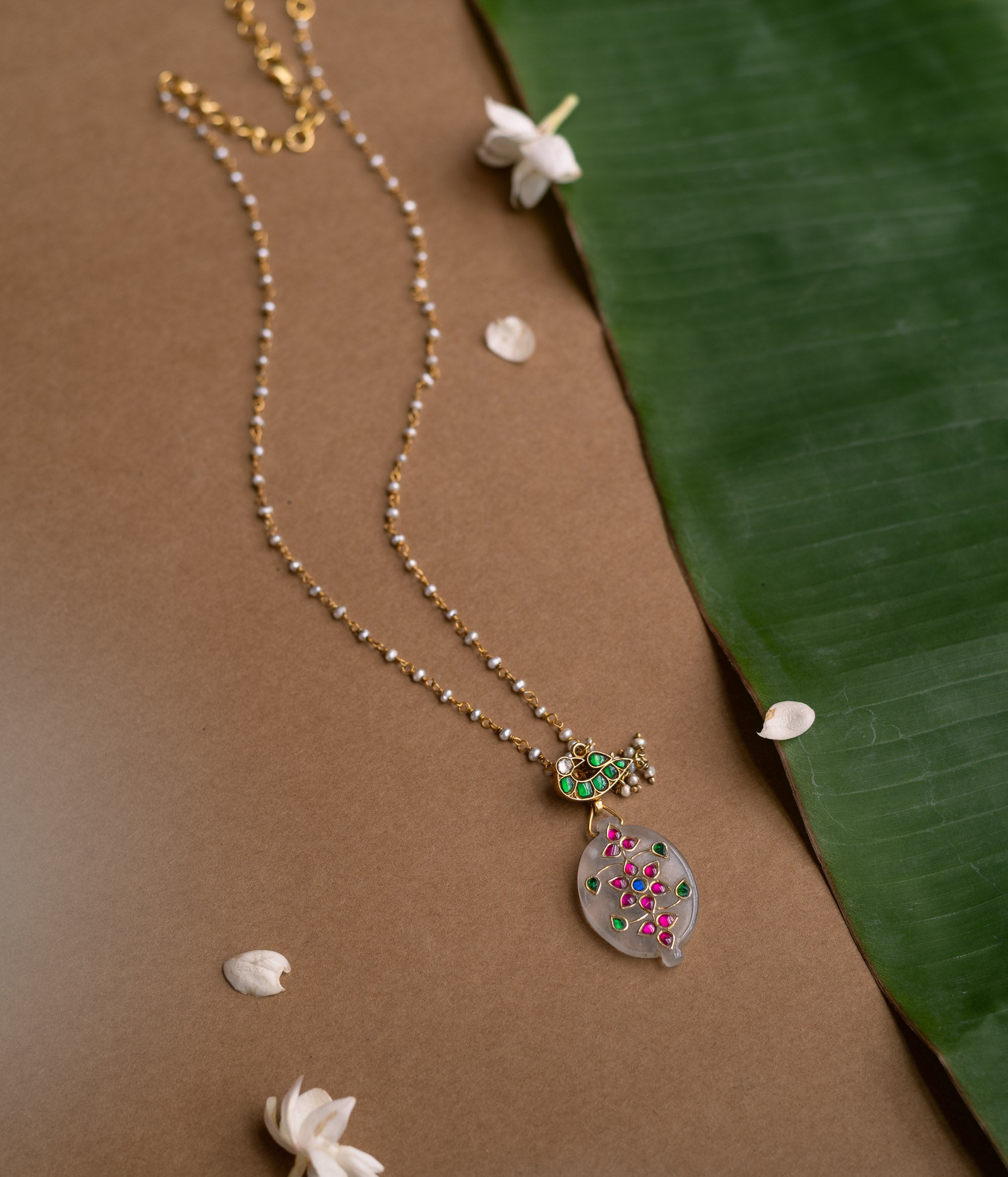 Hue Collection Lotus Glow Necklace with floral enamel pendant and delicate beaded chain.