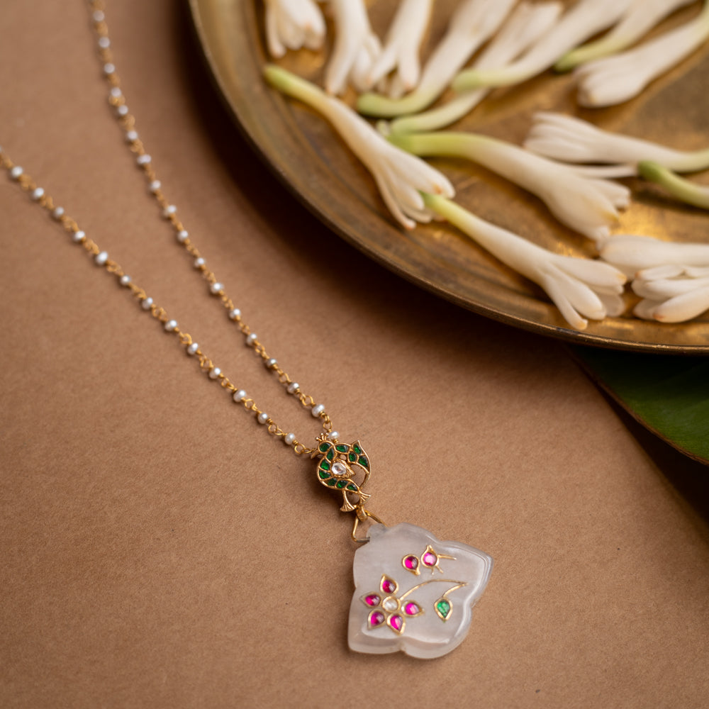 Hue collection crystal petal chain with pearls, pink stones, and green stone floral motif pendant.