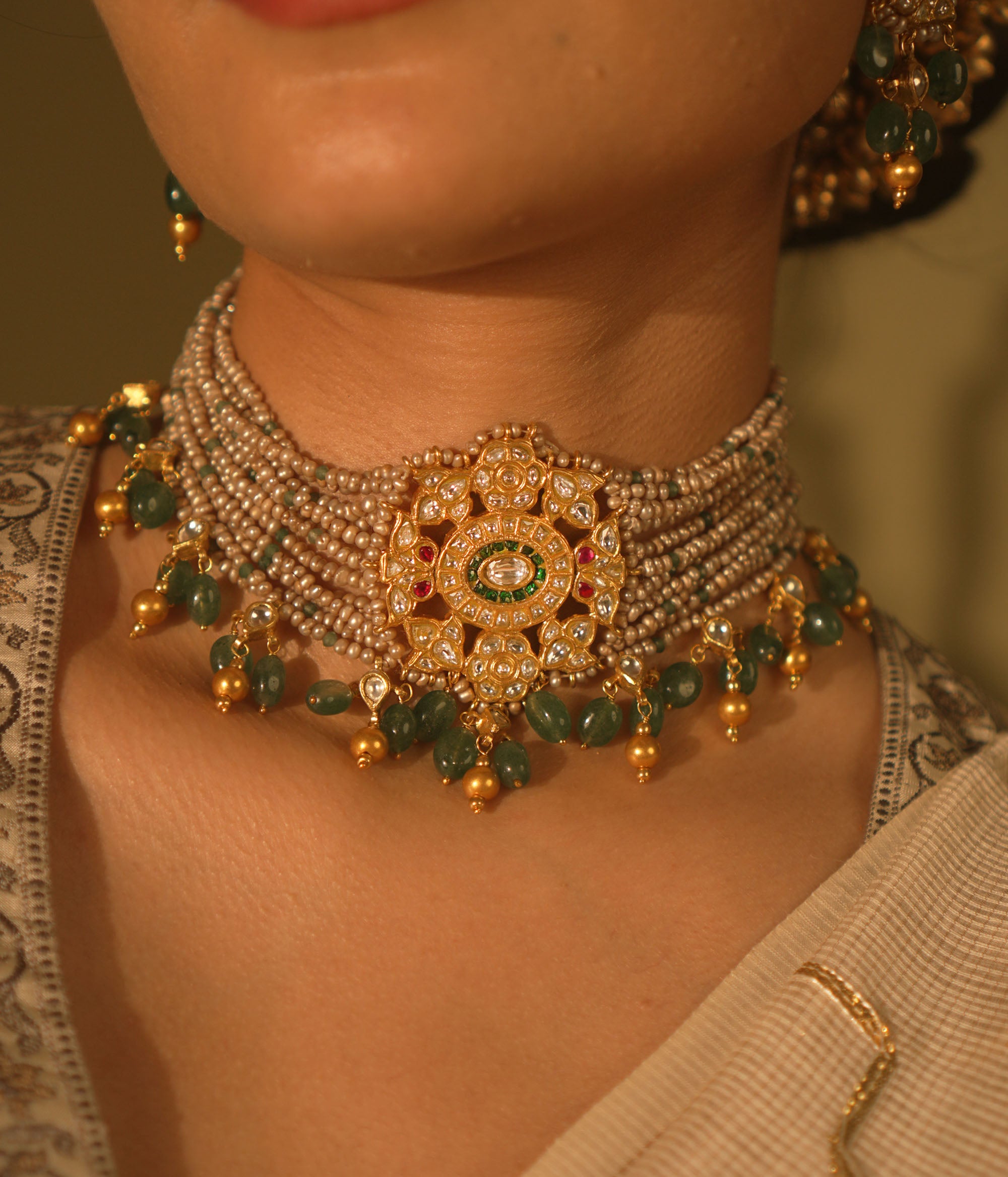  Heritage choker with temple medallion, rubies, emeralds, pearls and gold veiling—ancestral, elegant, and divine.
