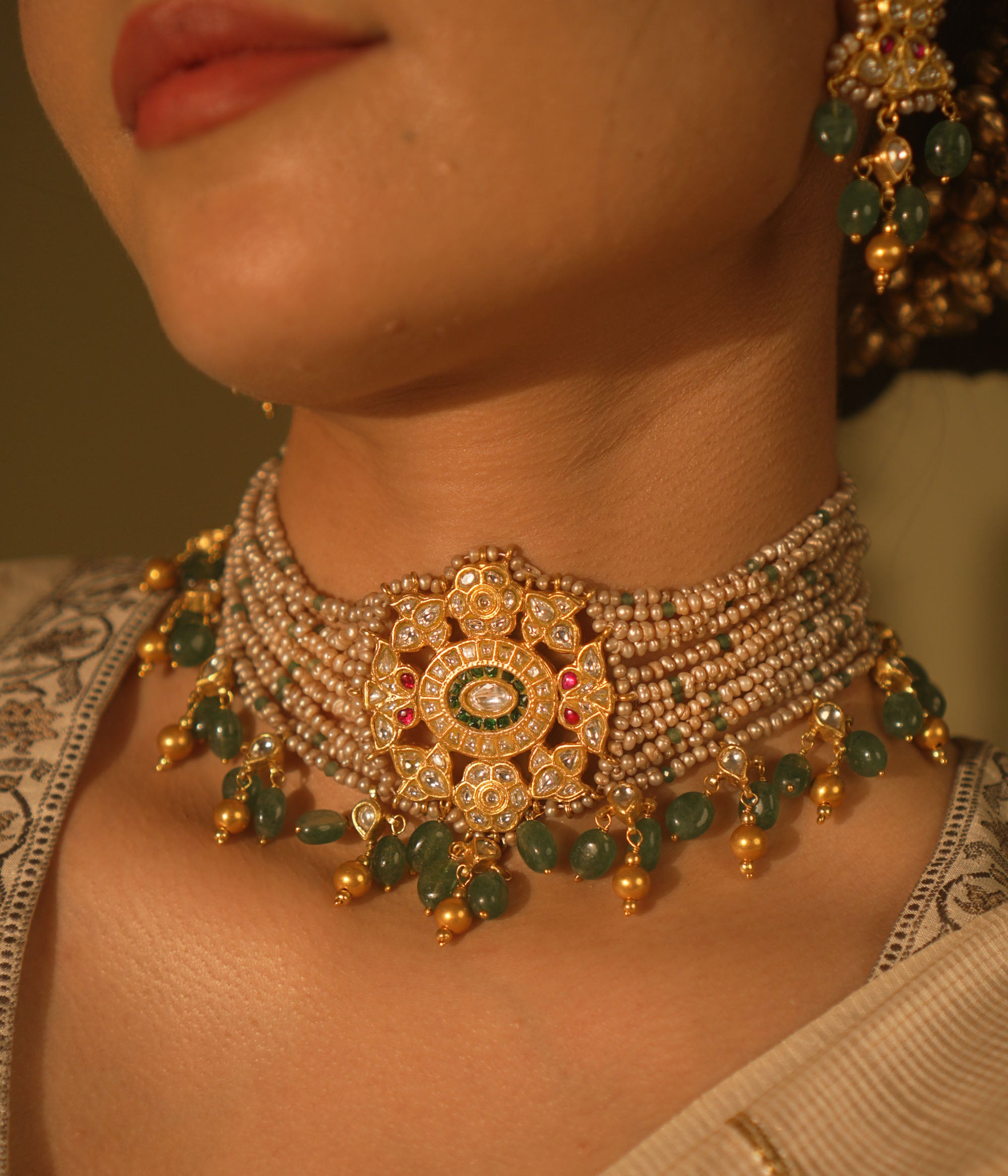 Heritage choker with temple medallion, rubies, emeralds, pearls and gold veiling—ancestral, elegant, and divine.