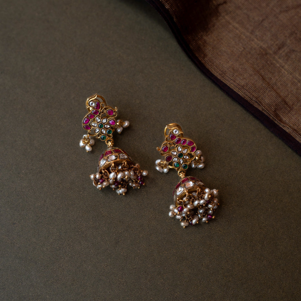 Silver Jhumka Earrings with Pearls and Green Stones
