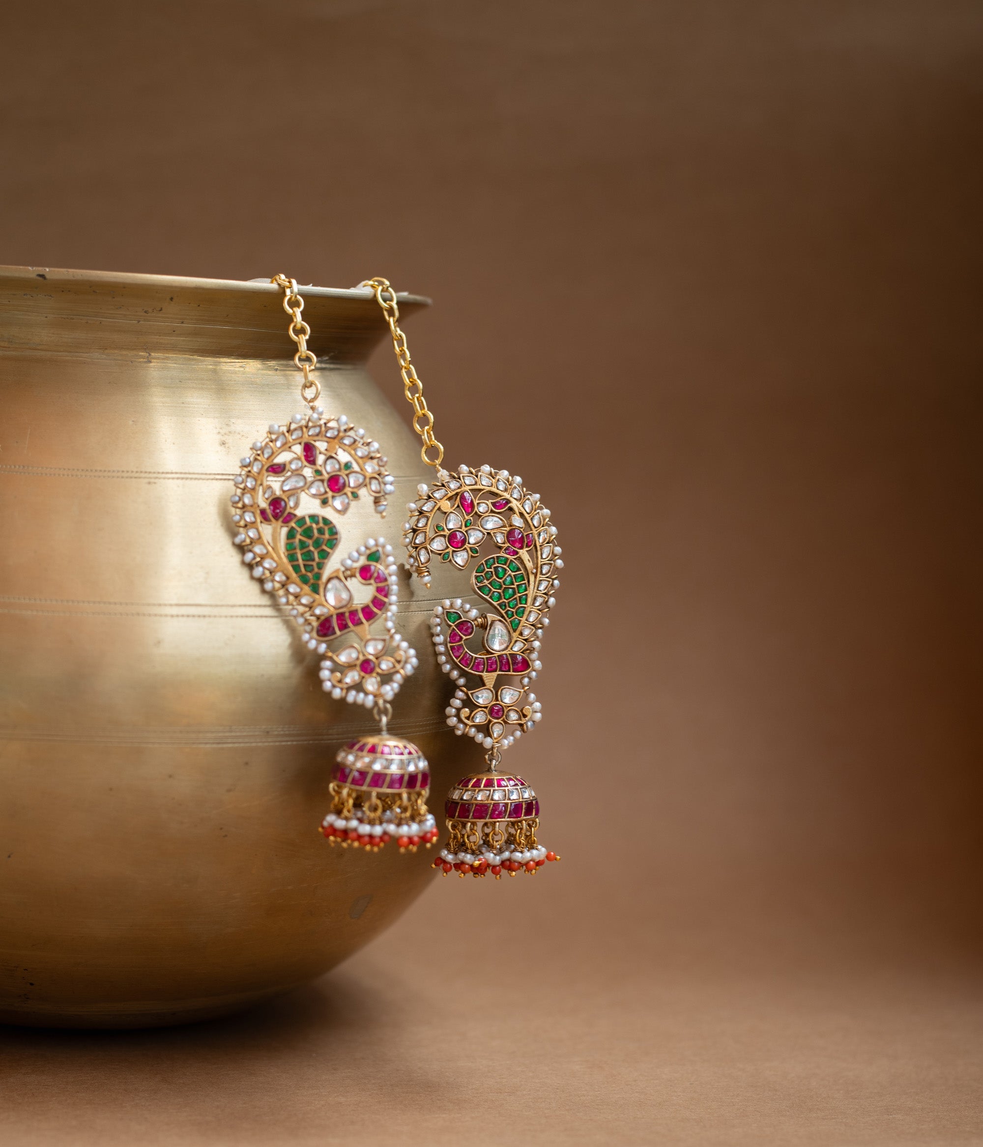 Kundan Collection paisley earrings with red, green, white kundan stones and pearl jhumka design.