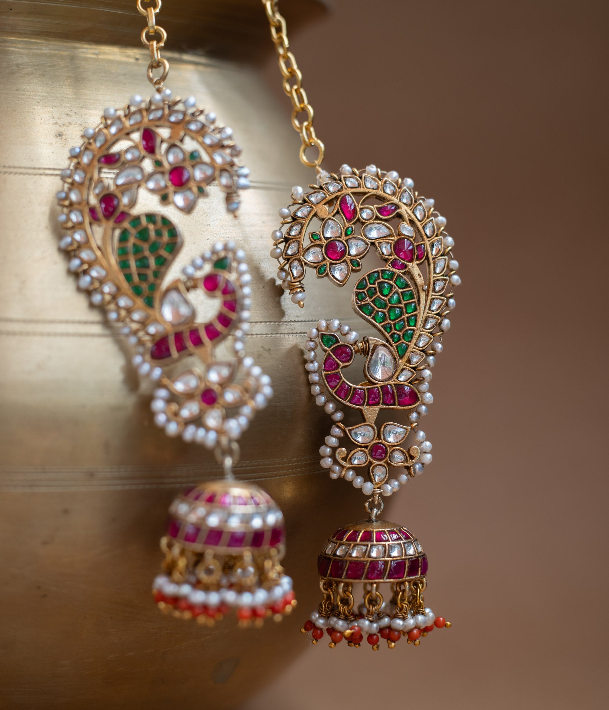 Kundan Collection paisley earrings with red, green, white kundan stones and pearl jhumka design.