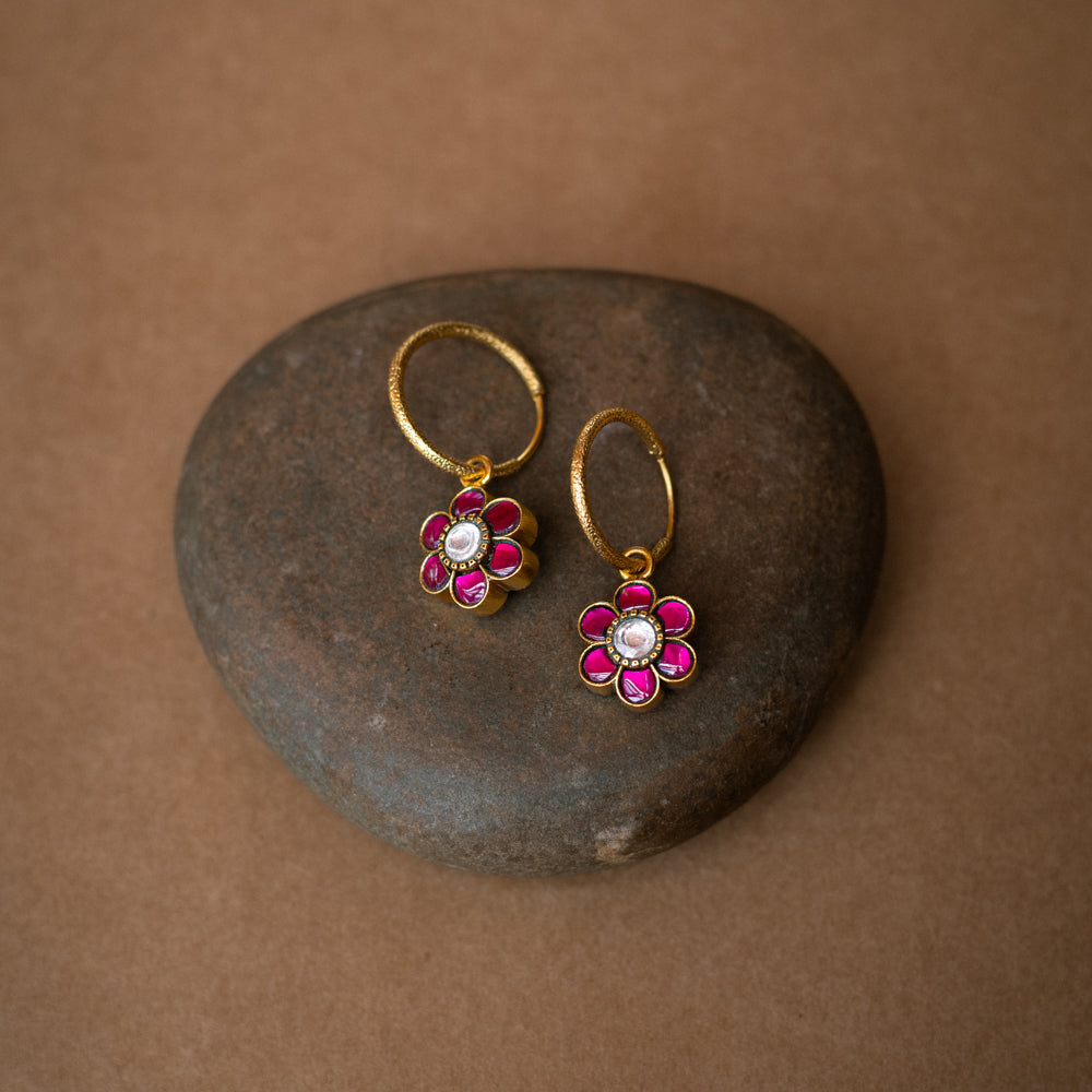 Floral-shaped reversible earrings with red and green Kundan stones from Kundan Collection.