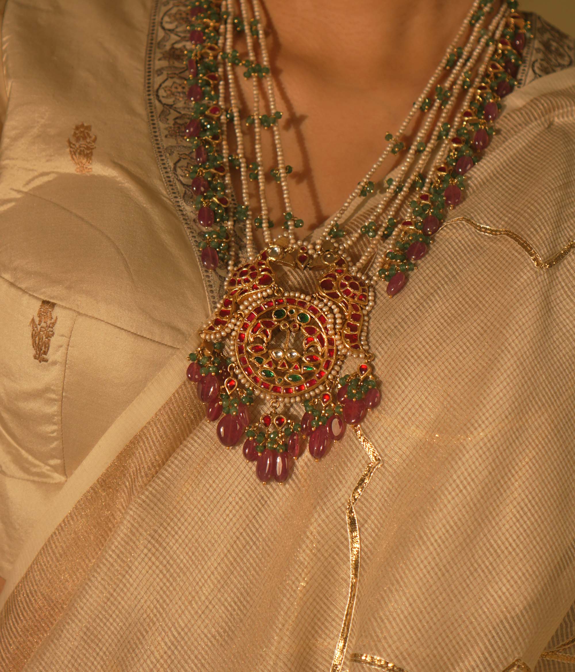Garden-inspired necklace with pink-green Kundan and pearls—nature’s beauty woven into fine jewelry.