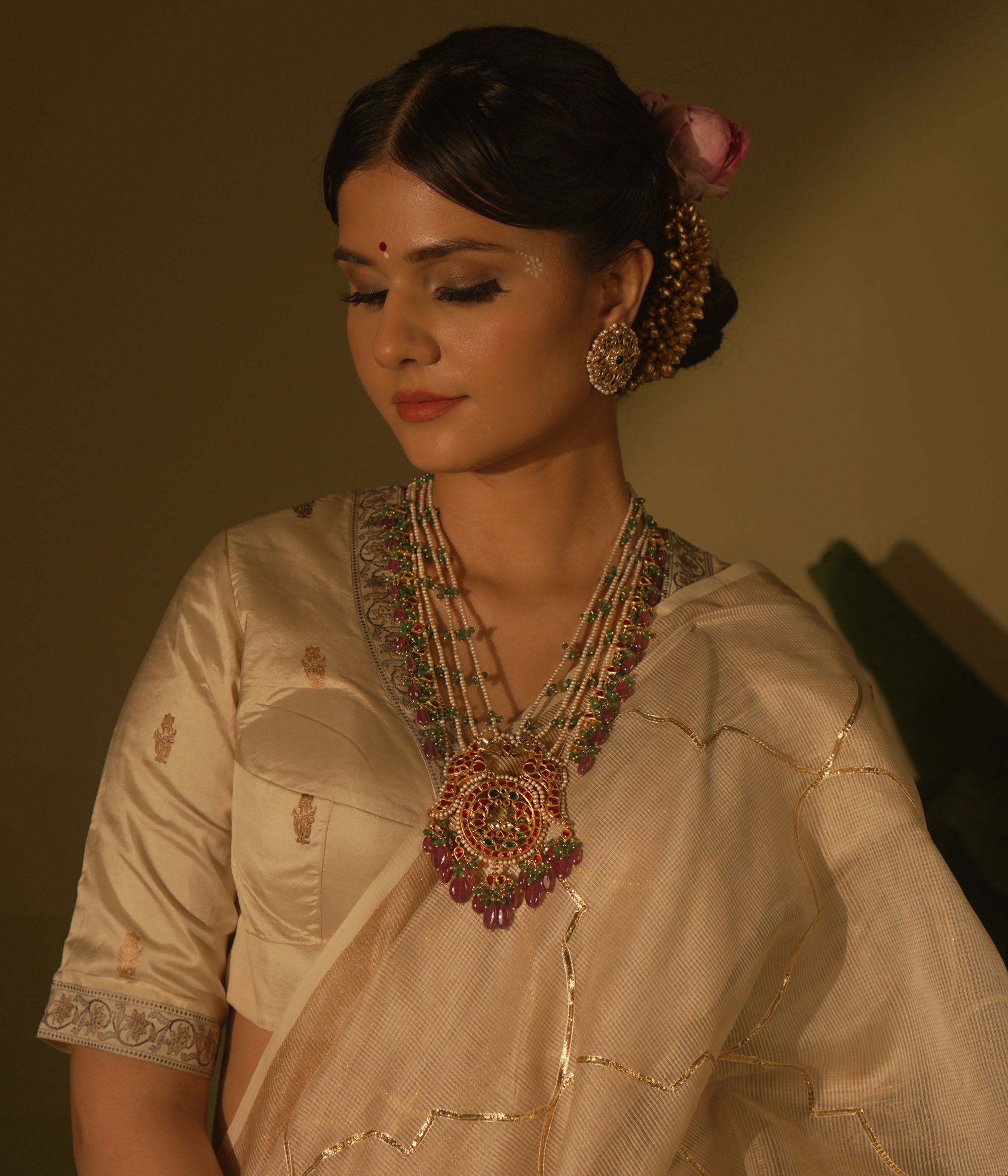 Garden-inspired necklace with pink-green Kundan and pearls—nature’s beauty woven into fine jewelry.
