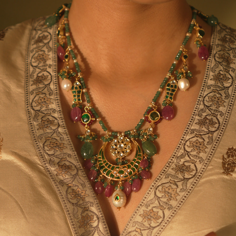 Regal heritage necklace with green stones, pearls, and enamel jhumka pendant—perfect for bridal elegance.