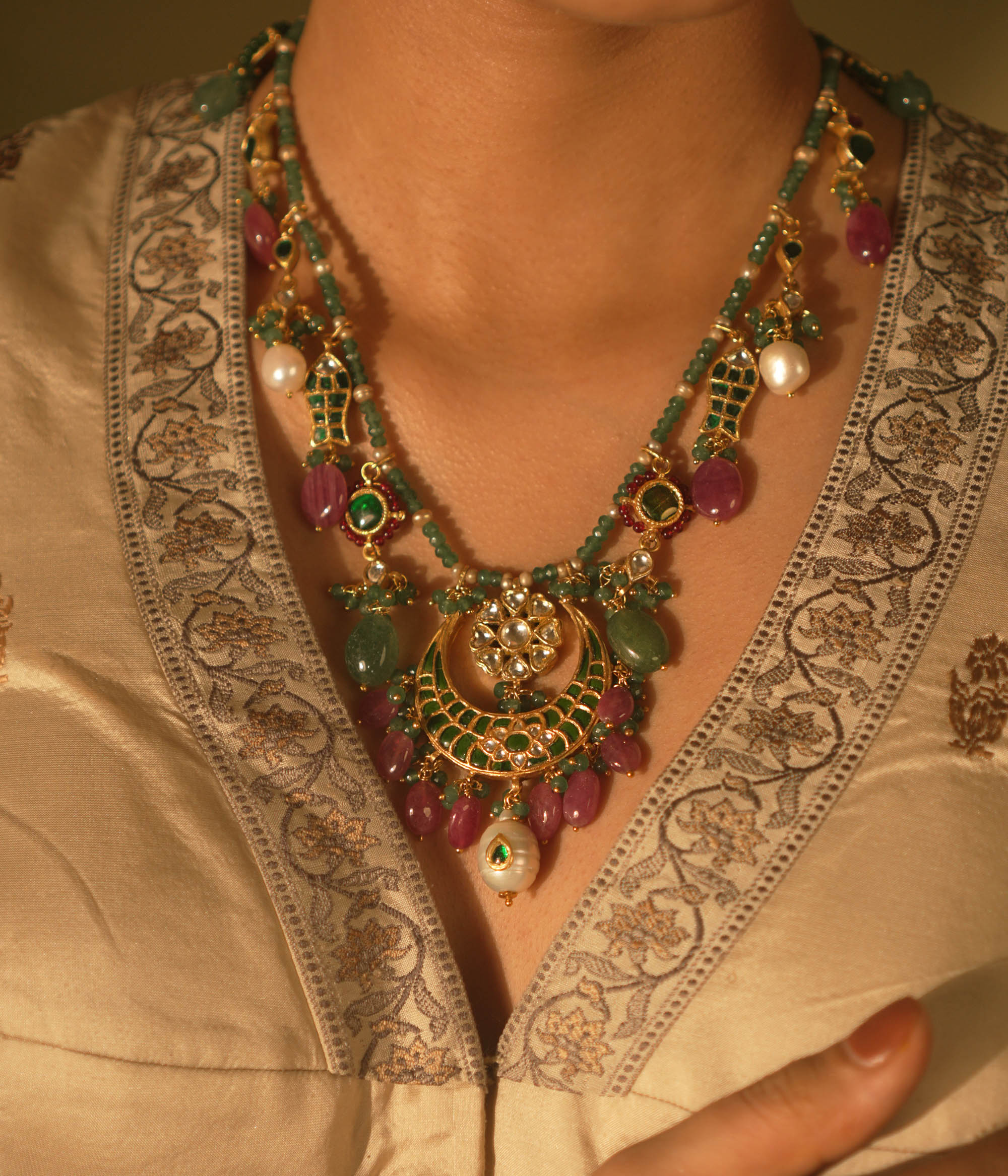  Regal heritage necklace with green stones, pearls, and enamel jhumka pendant—perfect for bridal elegance.
