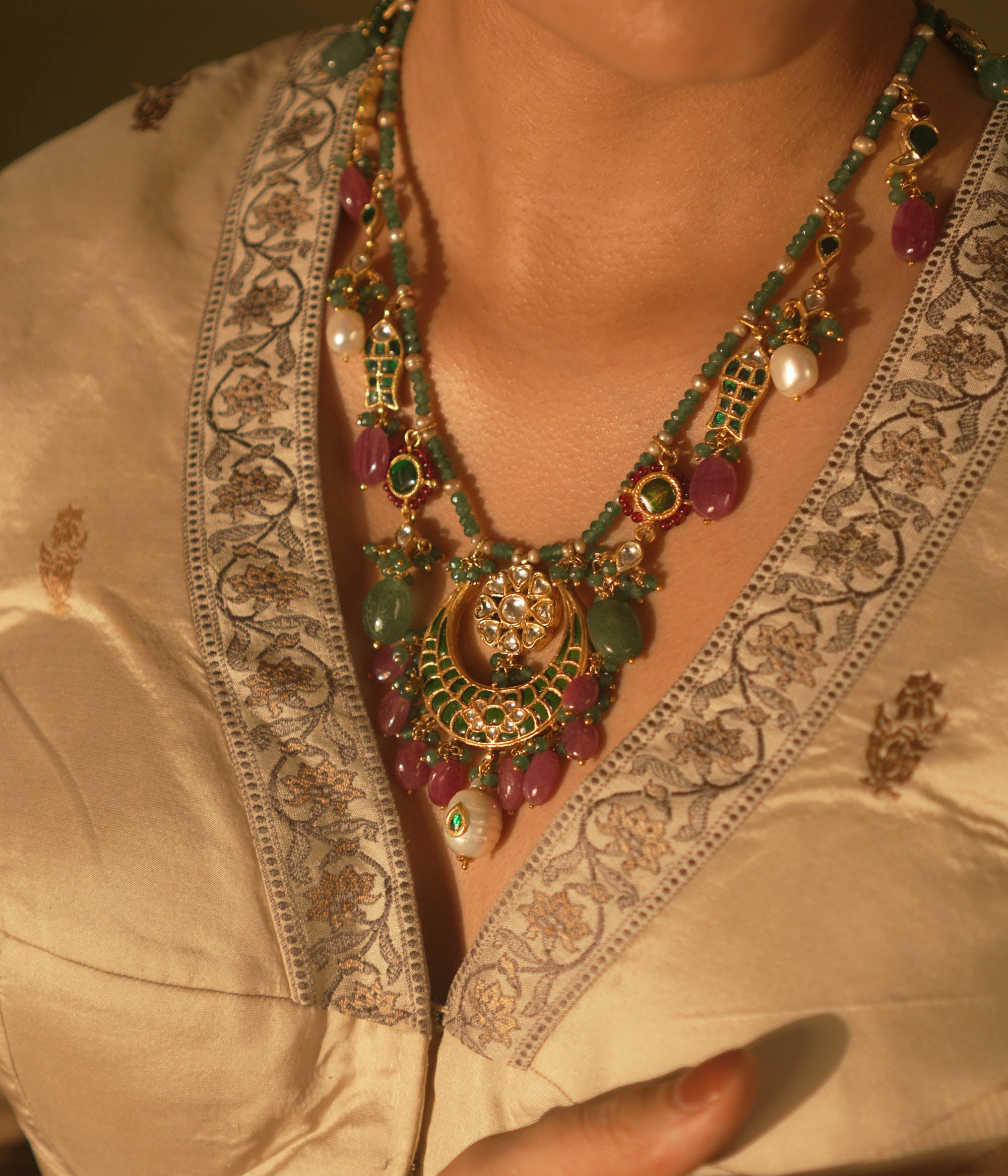  Regal heritage necklace with green stones, pearls, and enamel jhumka pendant—perfect for bridal elegance.