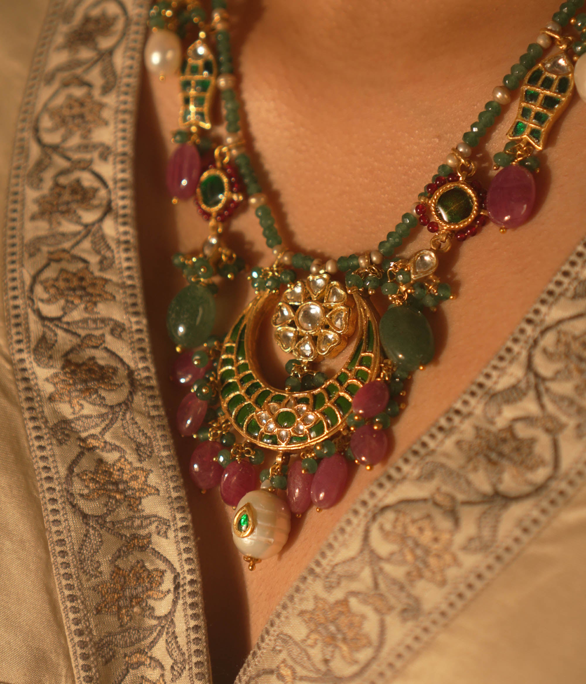  Regal heritage necklace with green stones, pearls, and enamel jhumka pendant—perfect for bridal elegance.