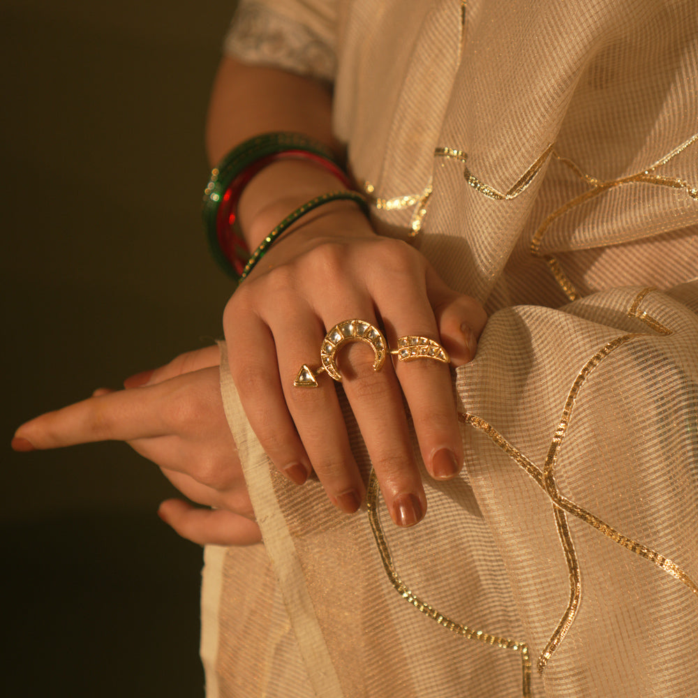 White crescent ring with tusk motif and Kundan sparkles—blending mystery, wisdom, and lunar allure.