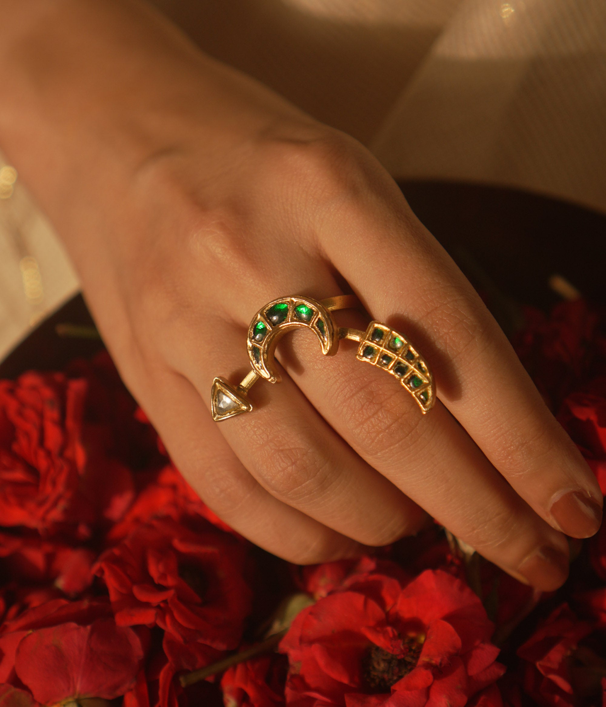  Crescent moon ring with green Kundan and tusk motif—symbolic, graceful, and timeless.
