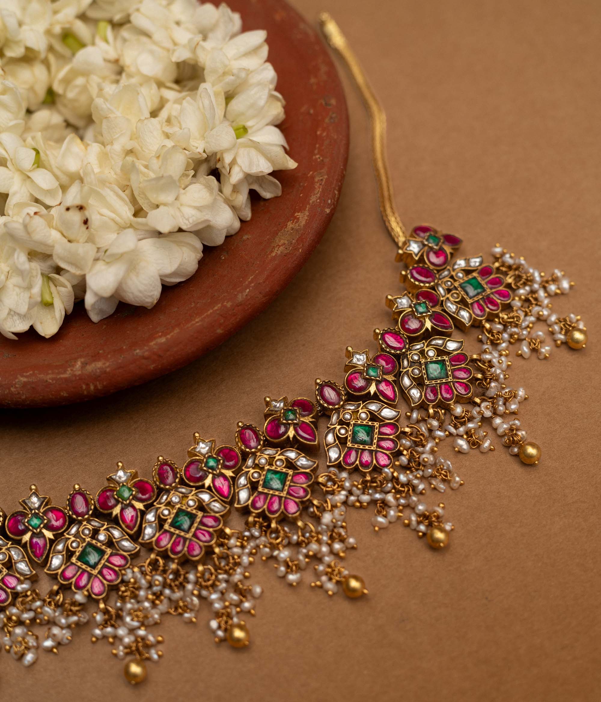 Traditional Malligai Charm Temple Choker in 92.5 Sterling Silver and 22ct Gold Plated, featuring Red Kundan, Green Kundan, White Kundan stones and Pearls, with intricate pearl and golden bead danglings.