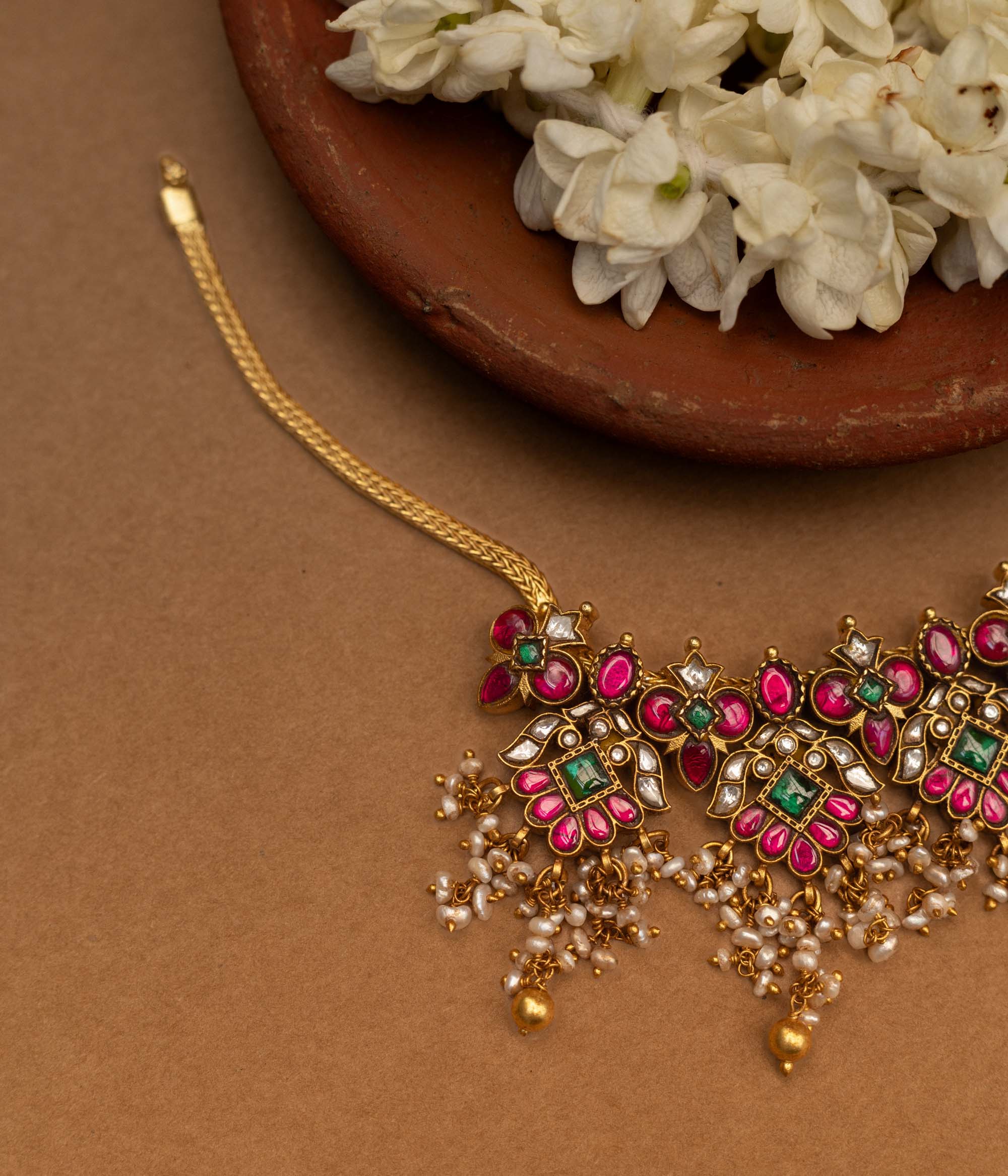 Traditional Malligai Charm Temple Choker in 92.5 Sterling Silver and 22ct Gold Plated, featuring Red Kundan, Green Kundan, White Kundan stones and Pearls, with intricate pearl and golden bead danglings.