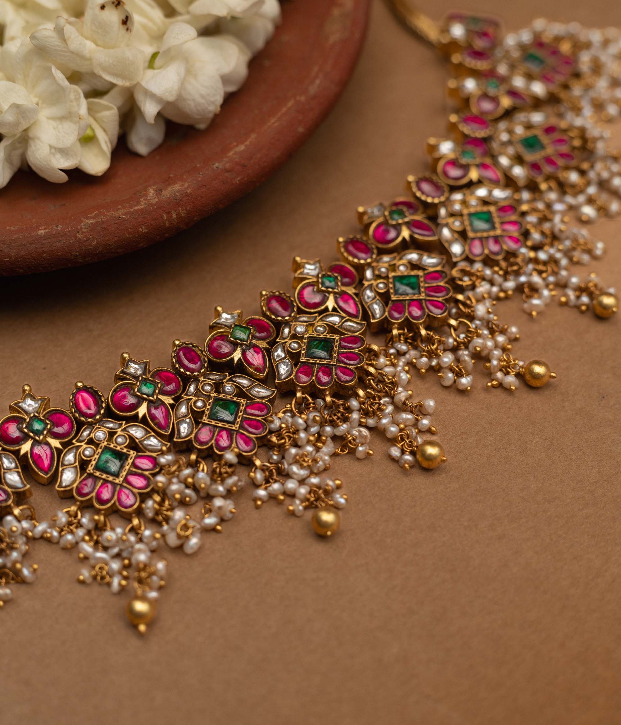 Traditional Malligai Charm Temple Choker in 92.5 Sterling Silver and 22ct Gold Plated, featuring Red Kundan, Green Kundan, White Kundan stones and Pearls, with intricate pearl and golden bead danglings.