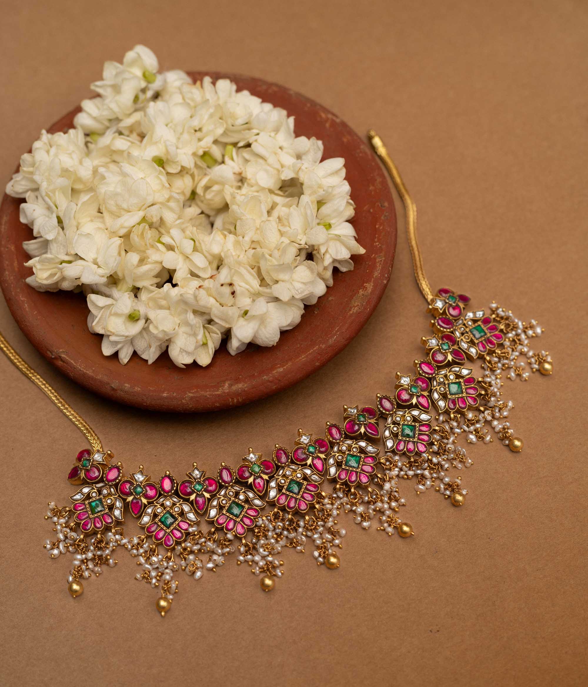 Traditional Malligai Charm Temple Choker in 92.5 Sterling Silver and 22ct Gold Plated, featuring Red Kundan, Green Kundan, White Kundan stones and Pearls, with intricate pearl and golden bead danglings.