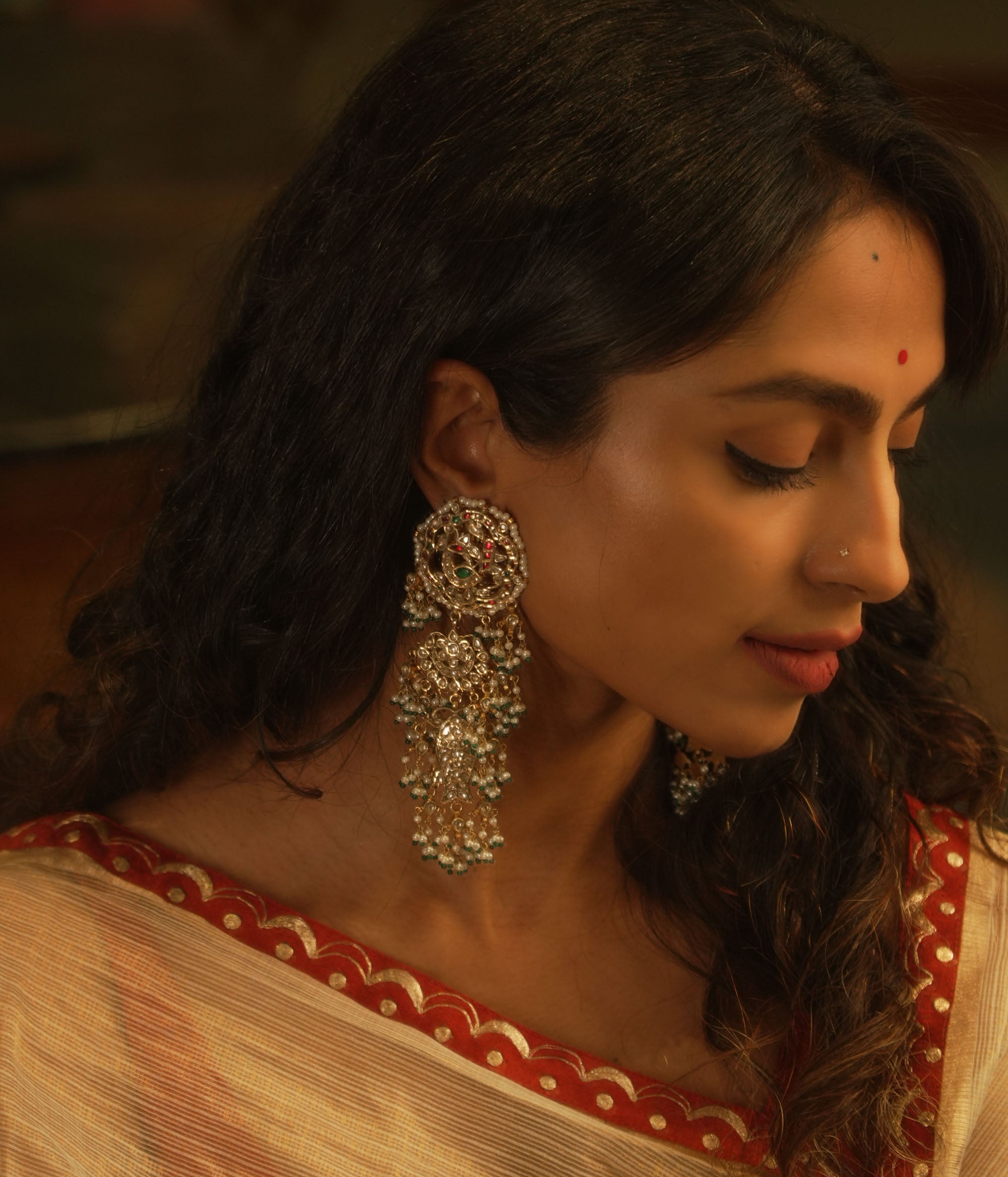 Ornate temple-style earrings with rubies, white sapphires, and pearl clusters from the Leelah collection.