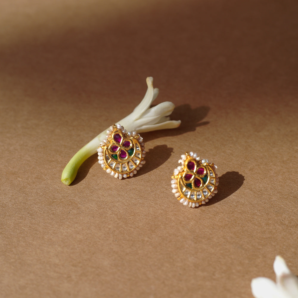 Gold earrings with ruby floral center, white sapphires, pearls, and green enamel from Leelah Collection.