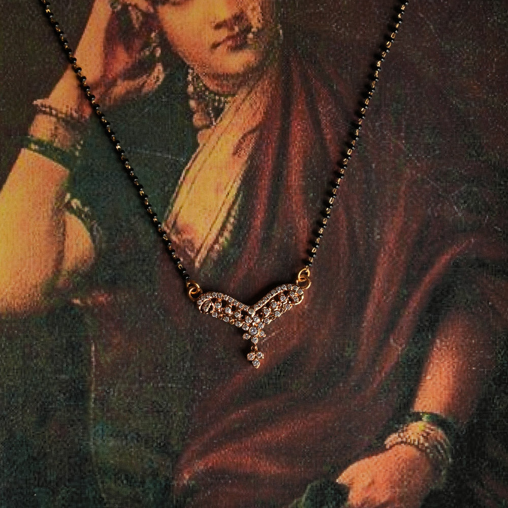 A handcrafted 92.5 sterling silver and 22ct gold-plated Mangalsutra featuring a delicate moissanite-set traditional pendant inspired by vintage Chettinad stone setting, blending timeless heritage with contemporary brilliance.