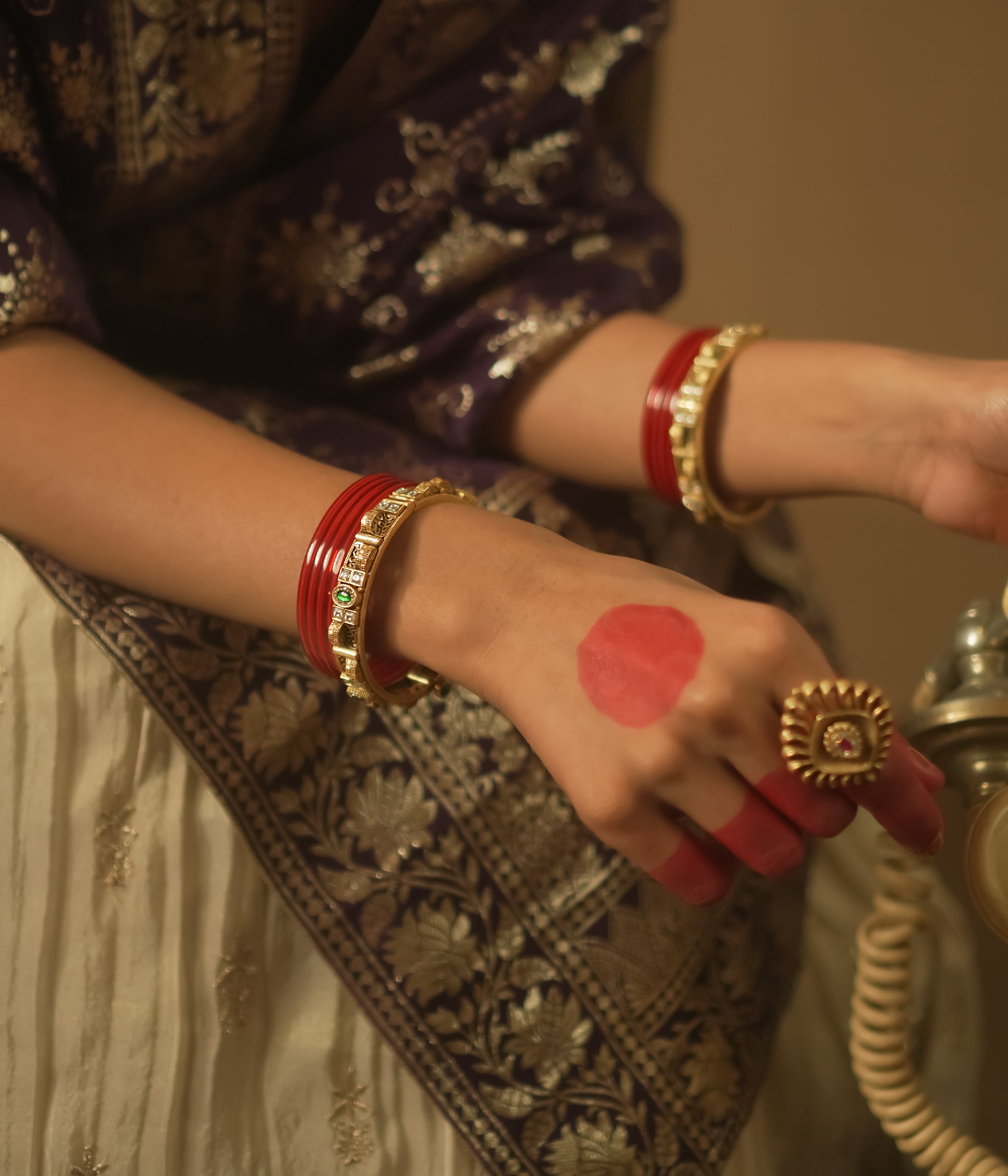 Gold-plated silver bangle with tiny gems and a sunburst pattern.