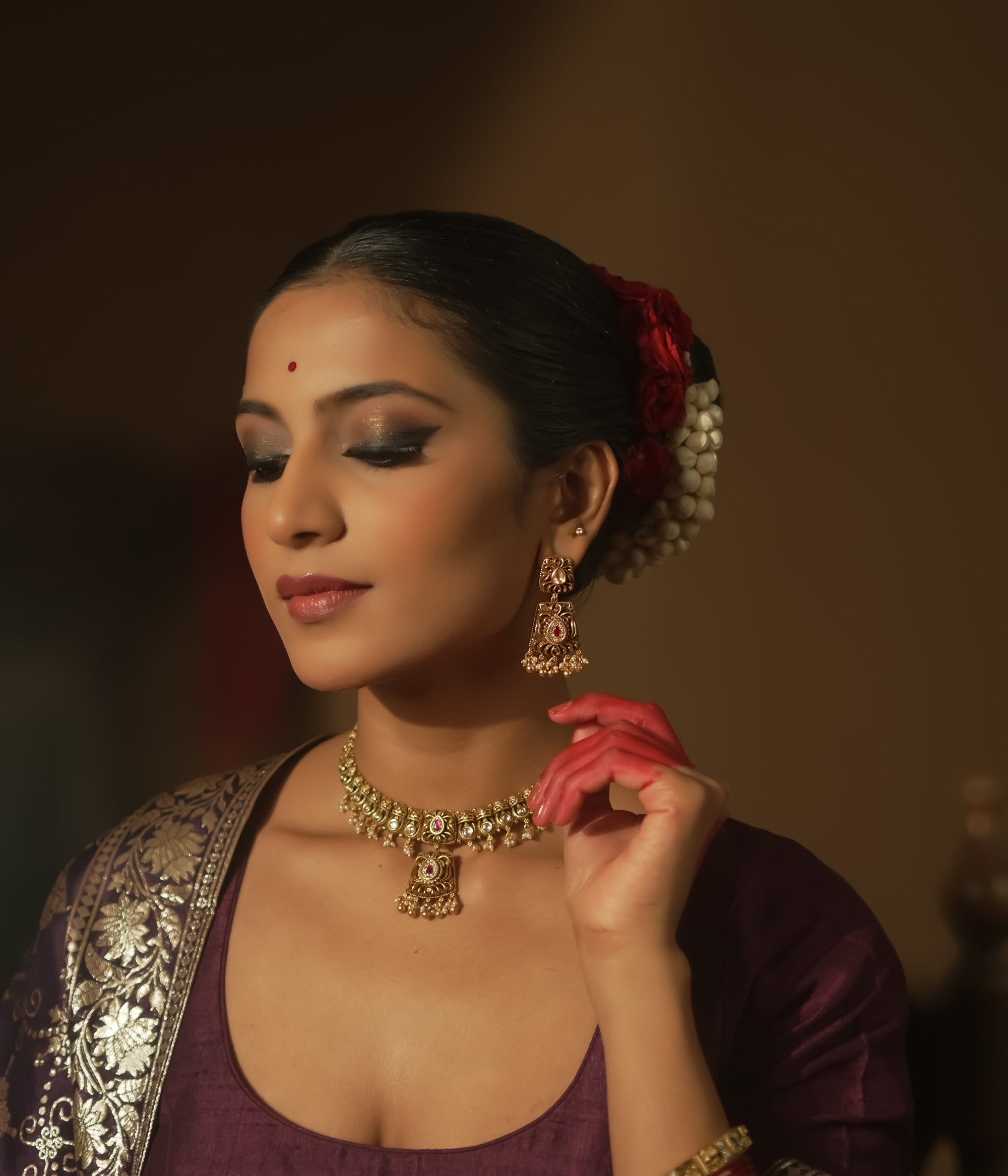 Intricate filigree earrings with teardrop gems, red stones, and pearls.