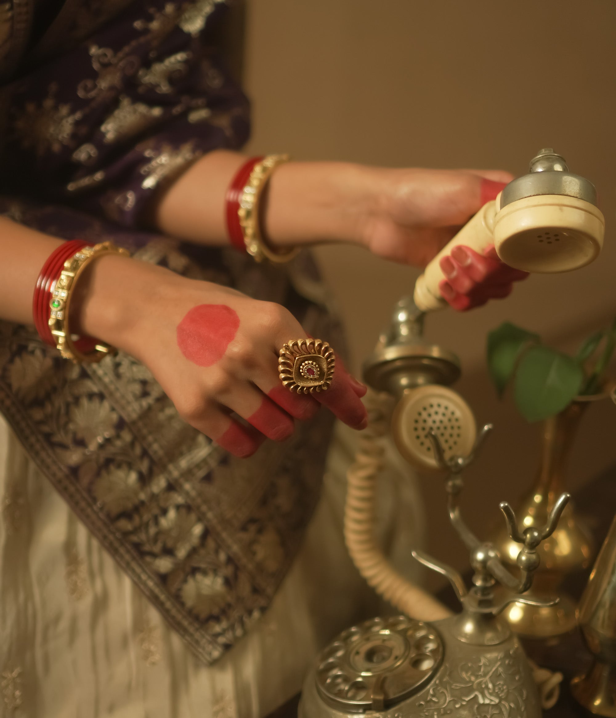 Gold-plated silver ring with a barfi-cut pink gem.