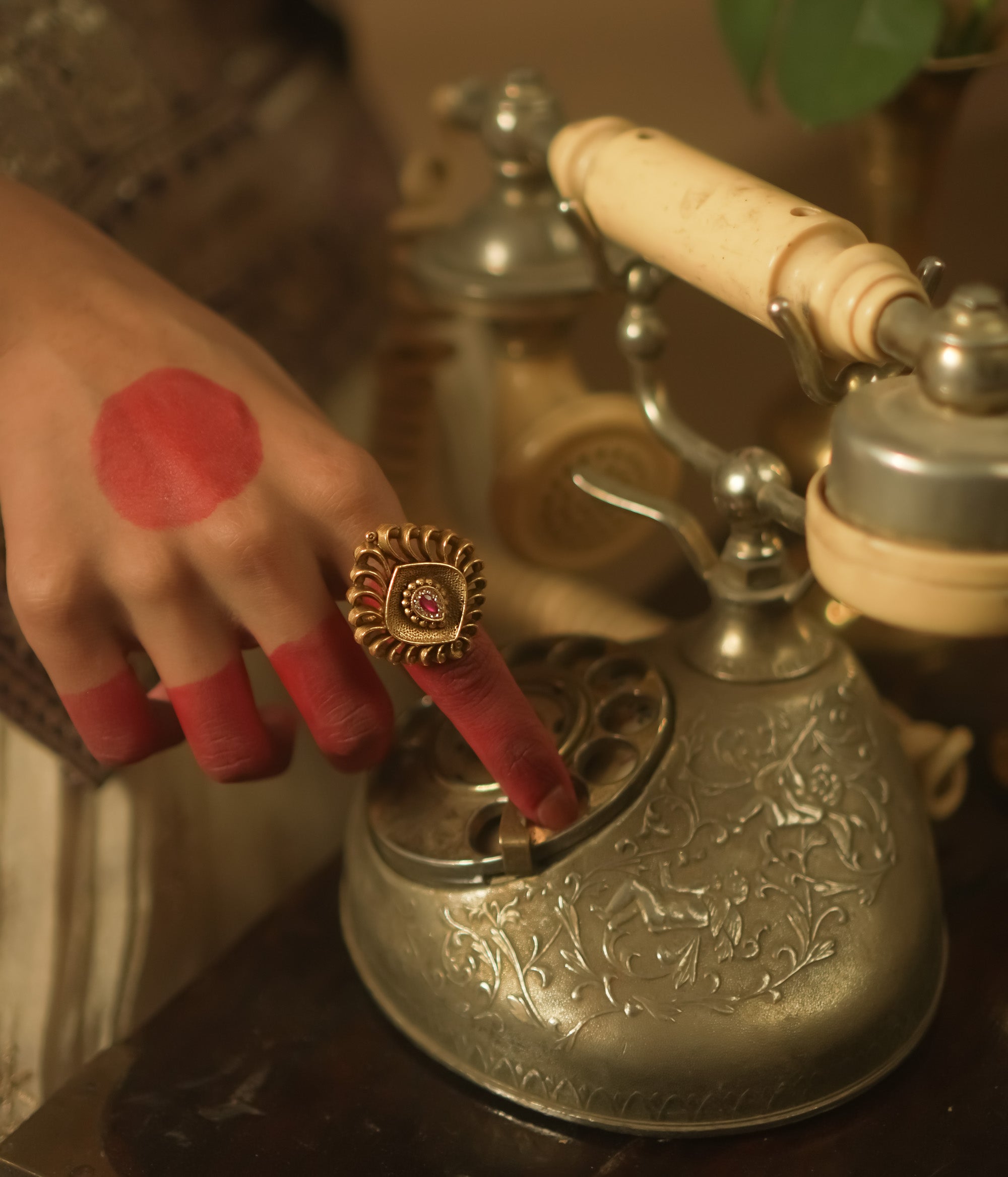 Gold-plated silver ring with a barfi-cut pink gem.