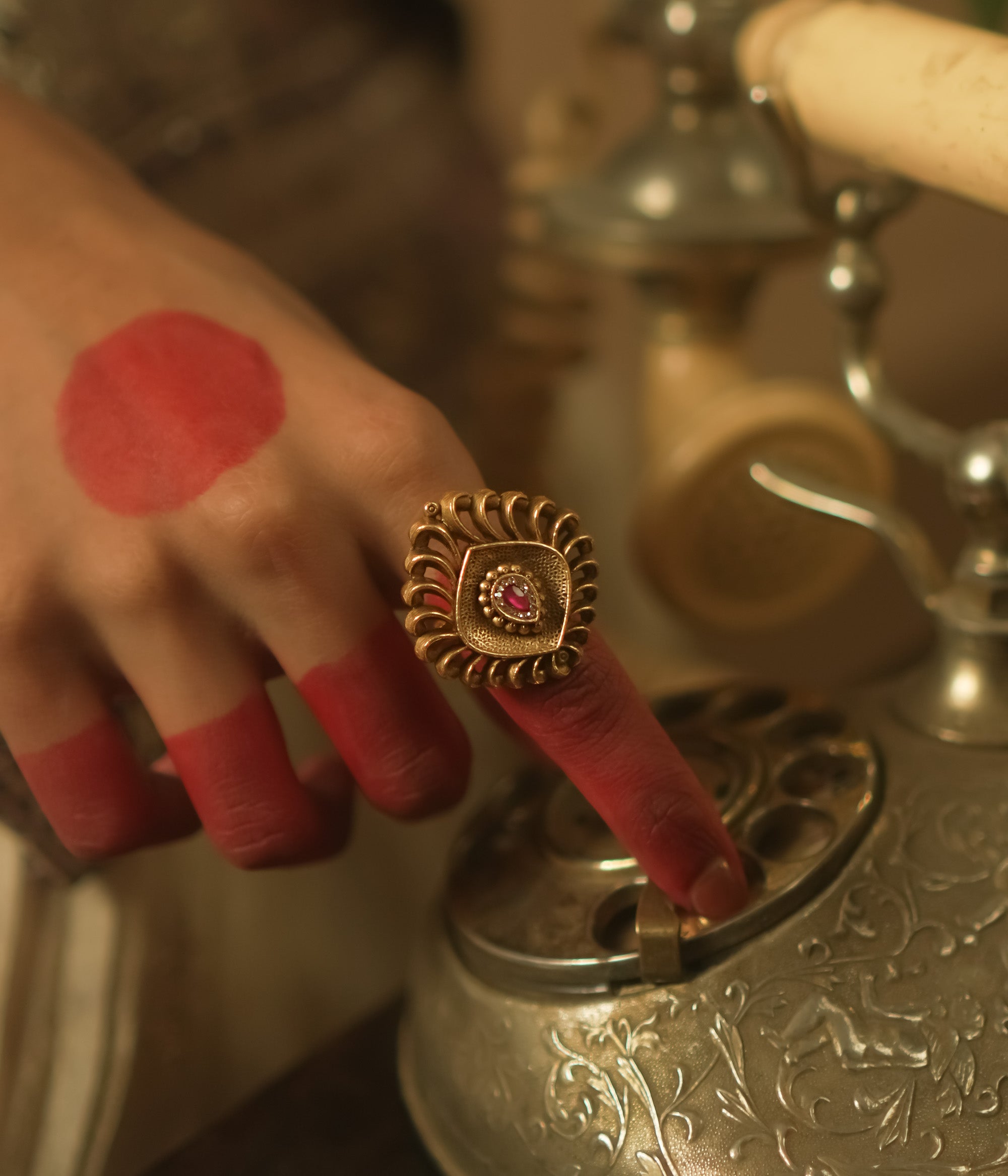 Gold-plated silver ring with a barfi-cut pink gem.