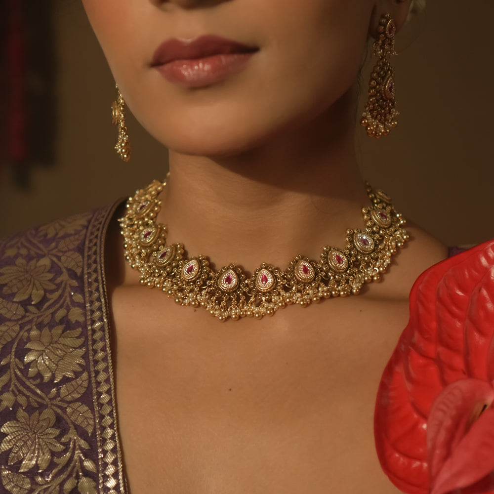 Gold-plated silver necklace with pink cultured rubies and tiny pearl balls.