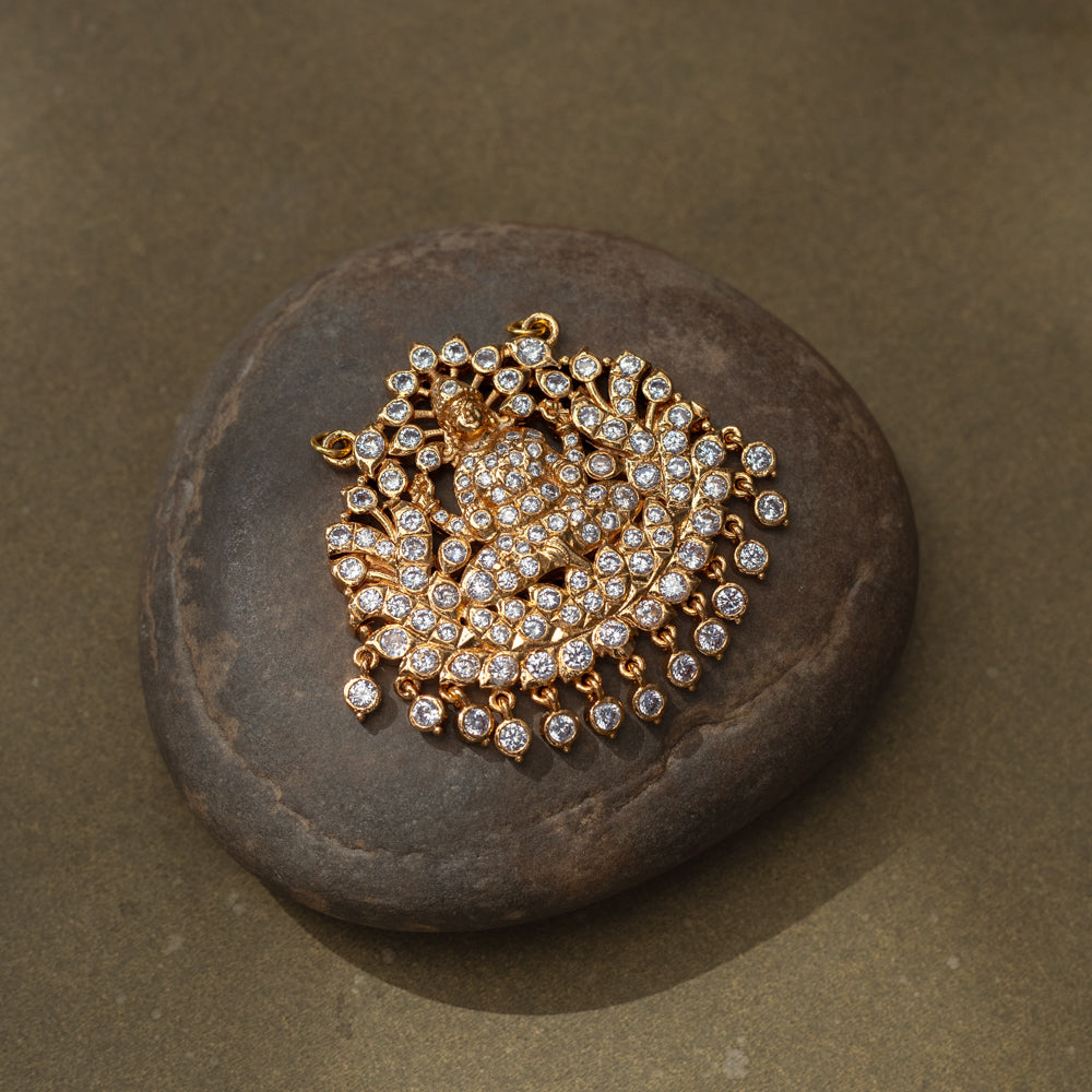 Gold pendant with goddess figure and CZ stones in a radiant circular design from Stone Collection.