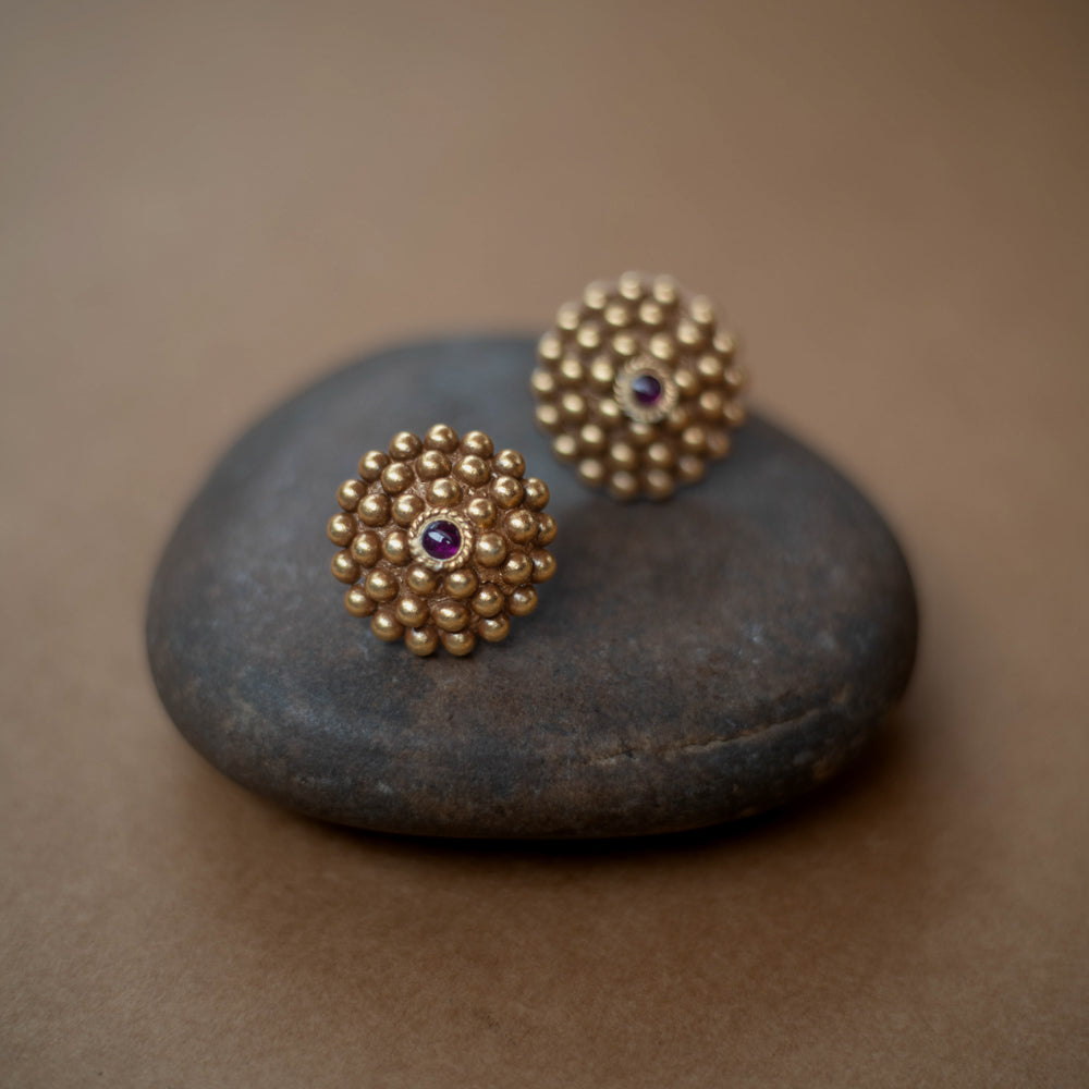 Tribal-style Rudhra earrings featuring red spinel stones, made in 92.5 sterling silver with 22ct gold plating.