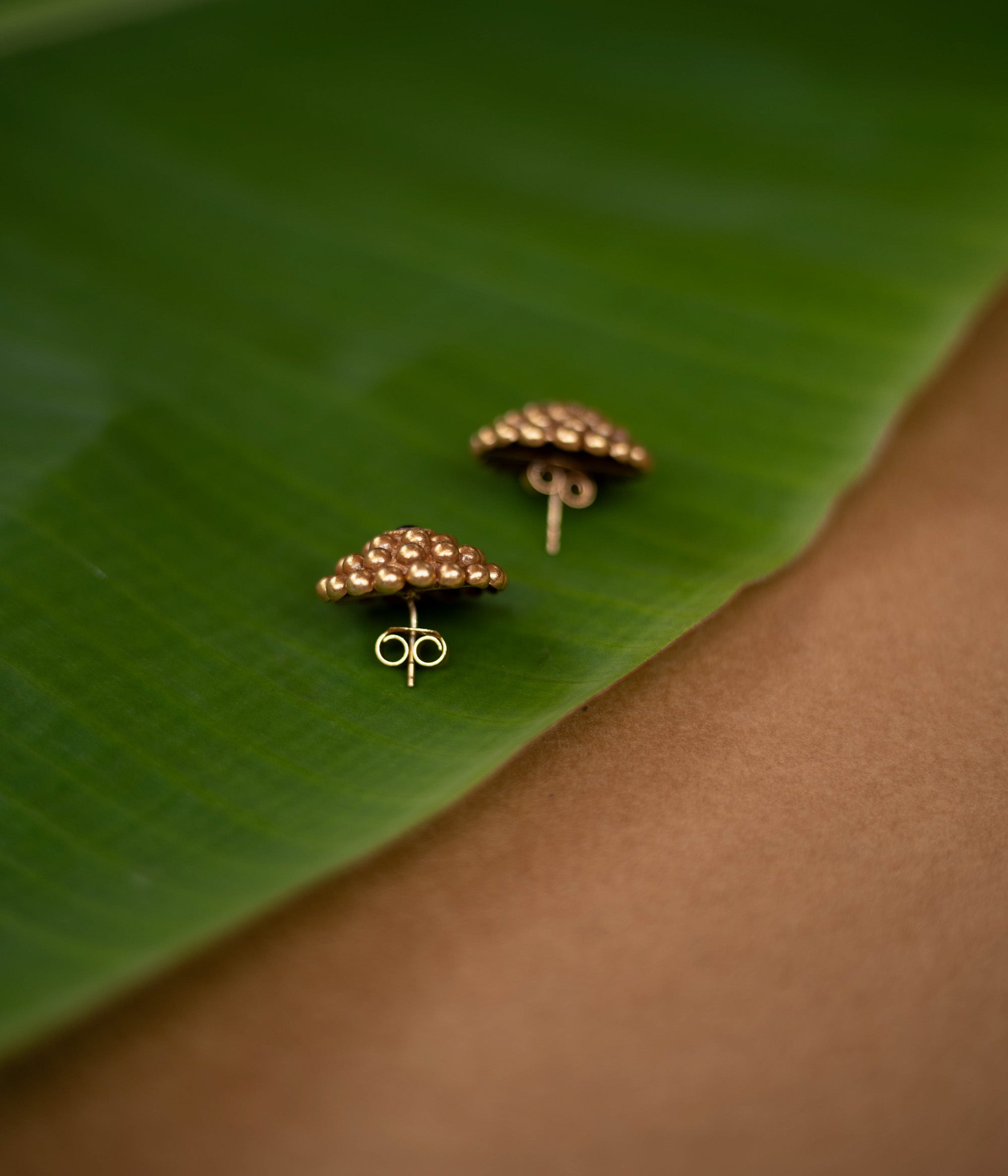 Tribal-style Rudhra earrings featuring red spinel stones, made in 92.5 sterling silver with 22ct gold plating.
